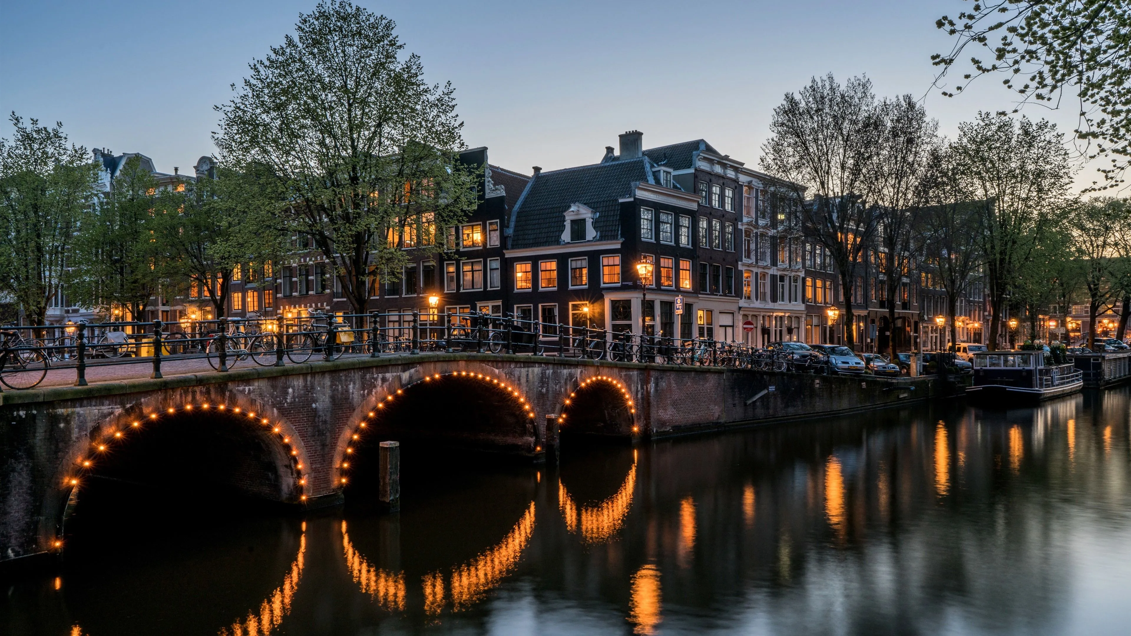 Wallpaper Amsterdam, night, city, river, bridge, houses, trees, lights 3840x2160 UHD 4K Picture, Image