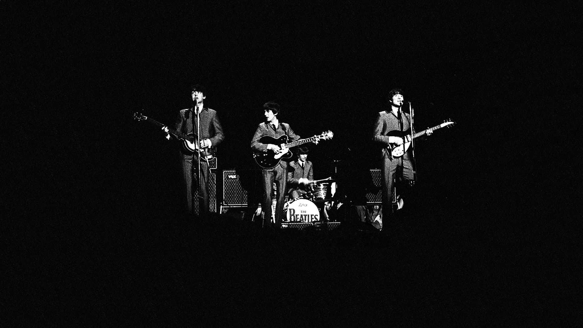 Download The Beatles Lads Enjoying a Live Performance