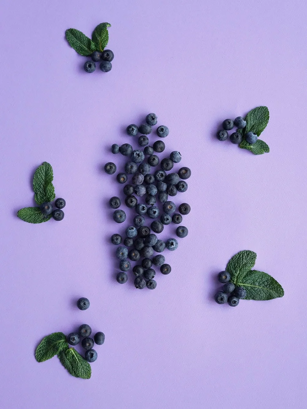 Download Blueberries In Aesthetic Purple Arrangement Wallpaper
