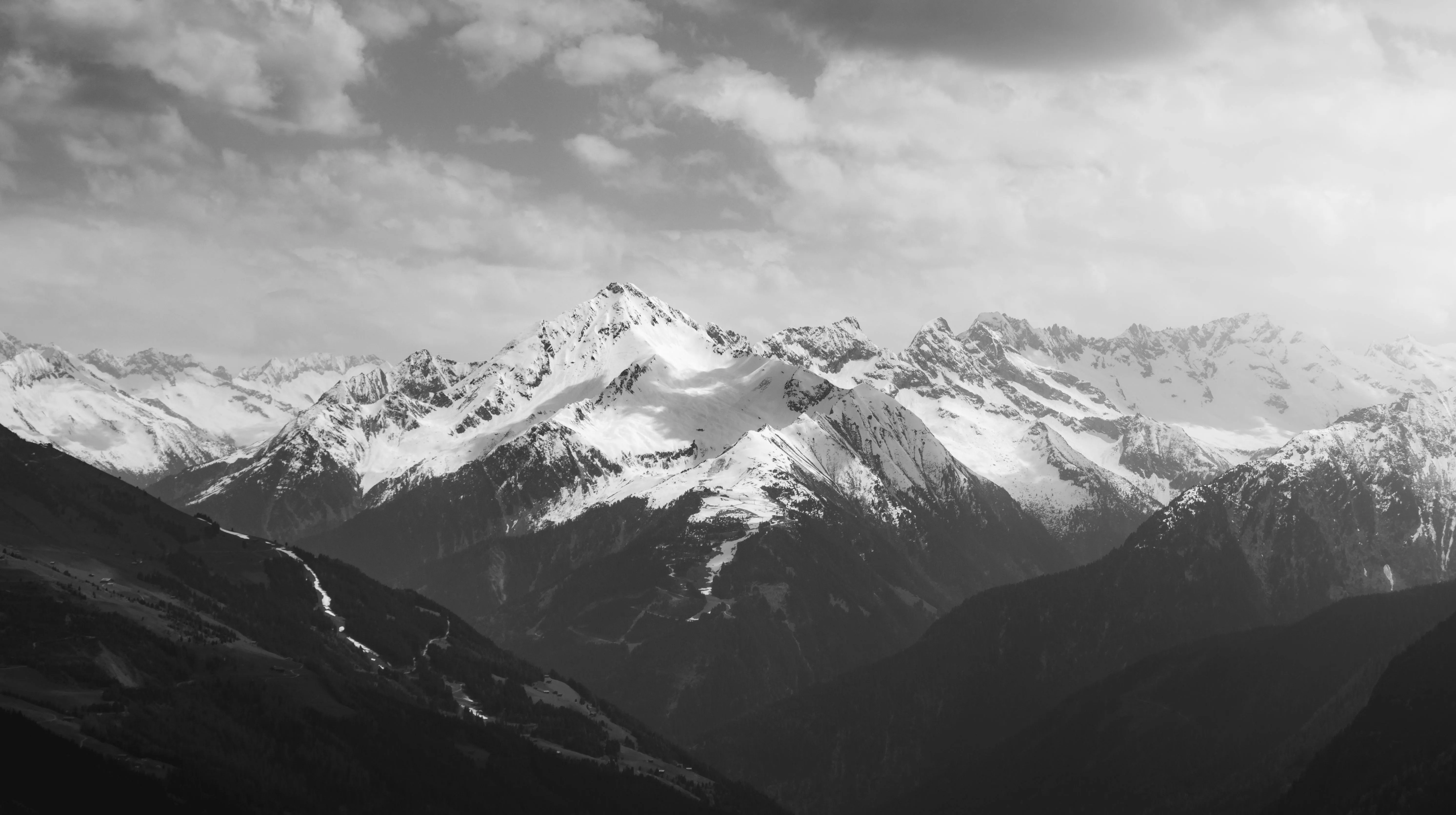 Black and white photo of mountains in the snow · Free