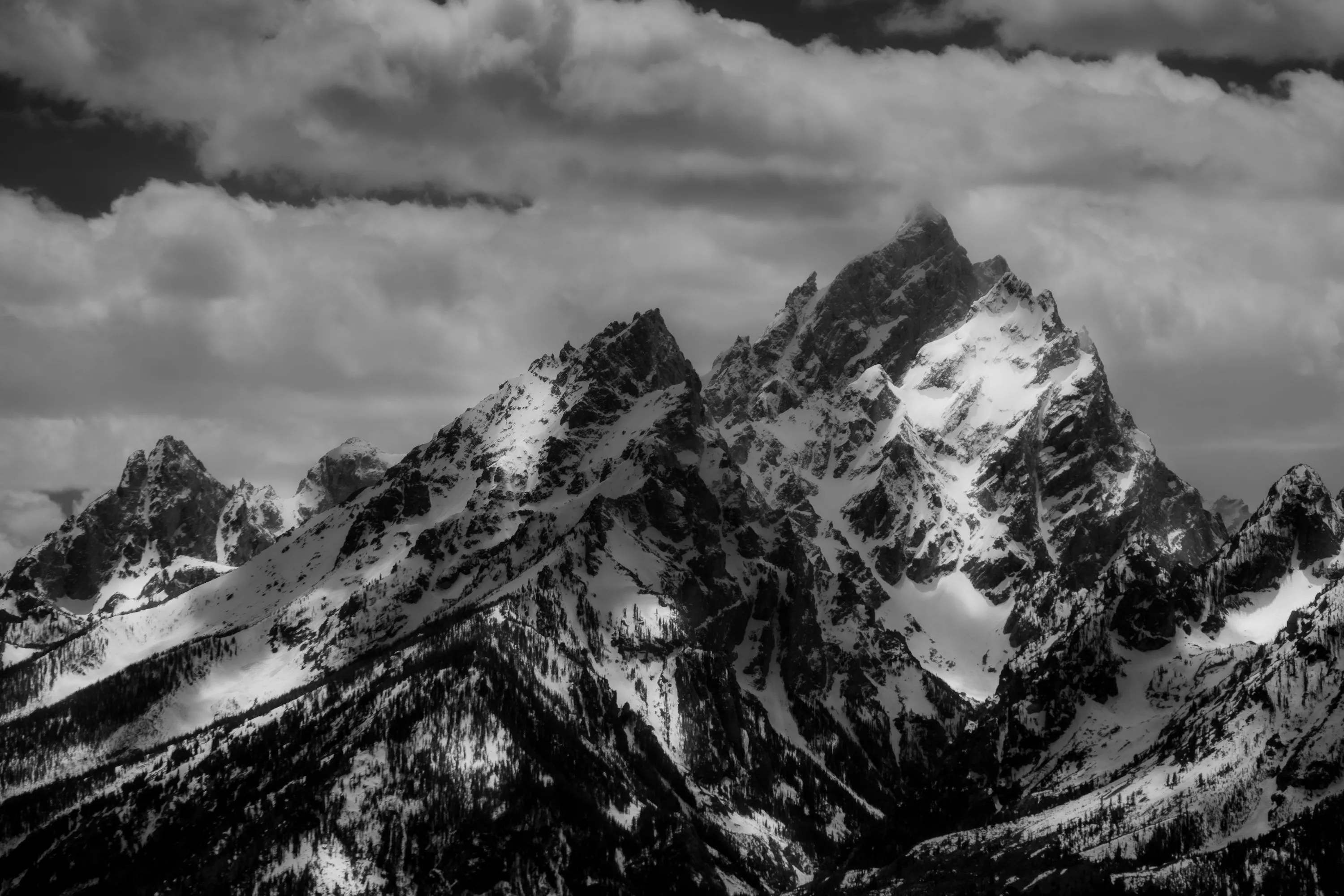 A black and white photo of a mountain range photo