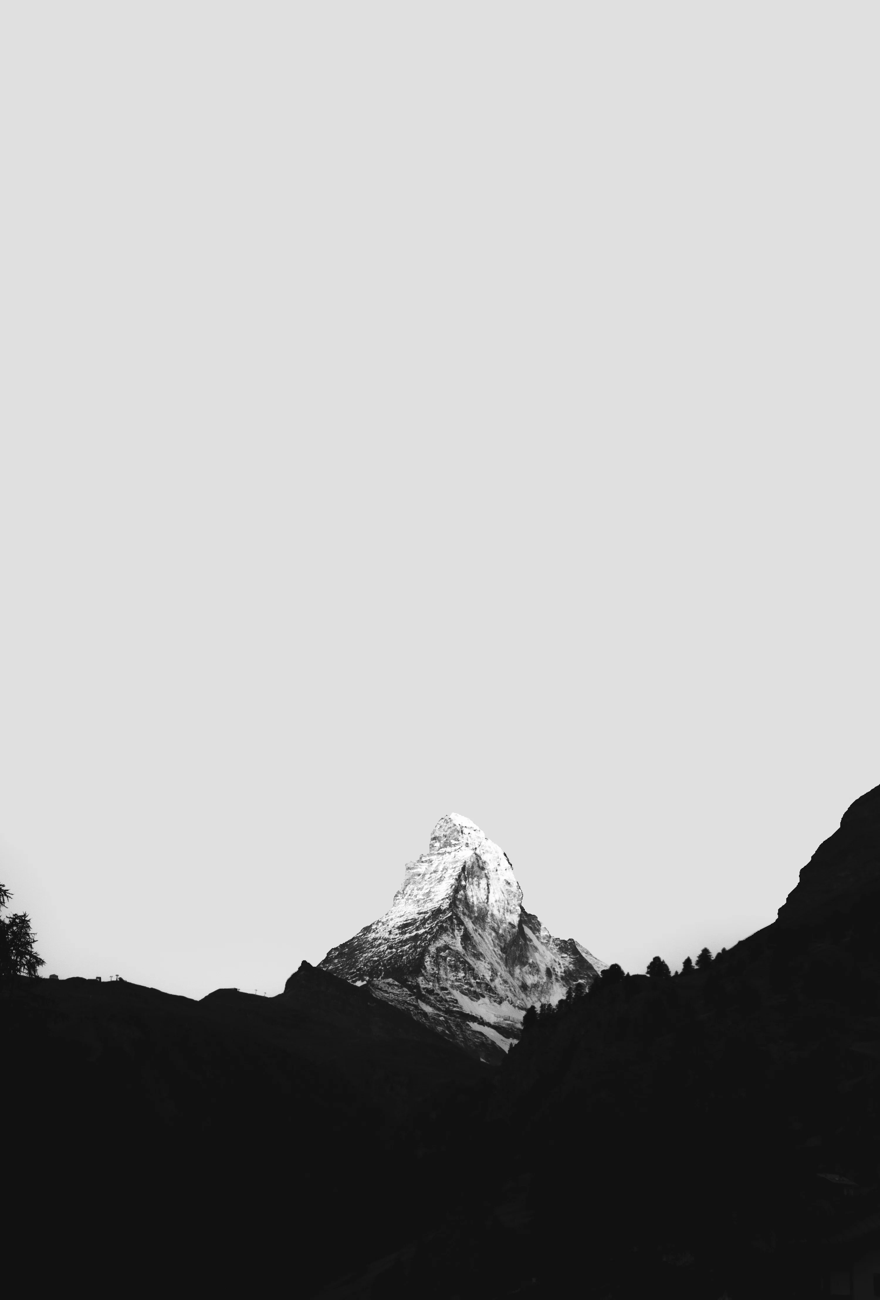 Grayscale photo of mountain range photo
