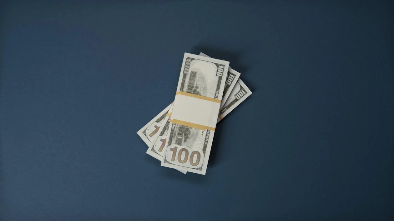 Dollar Bills on Blue Surface · Free