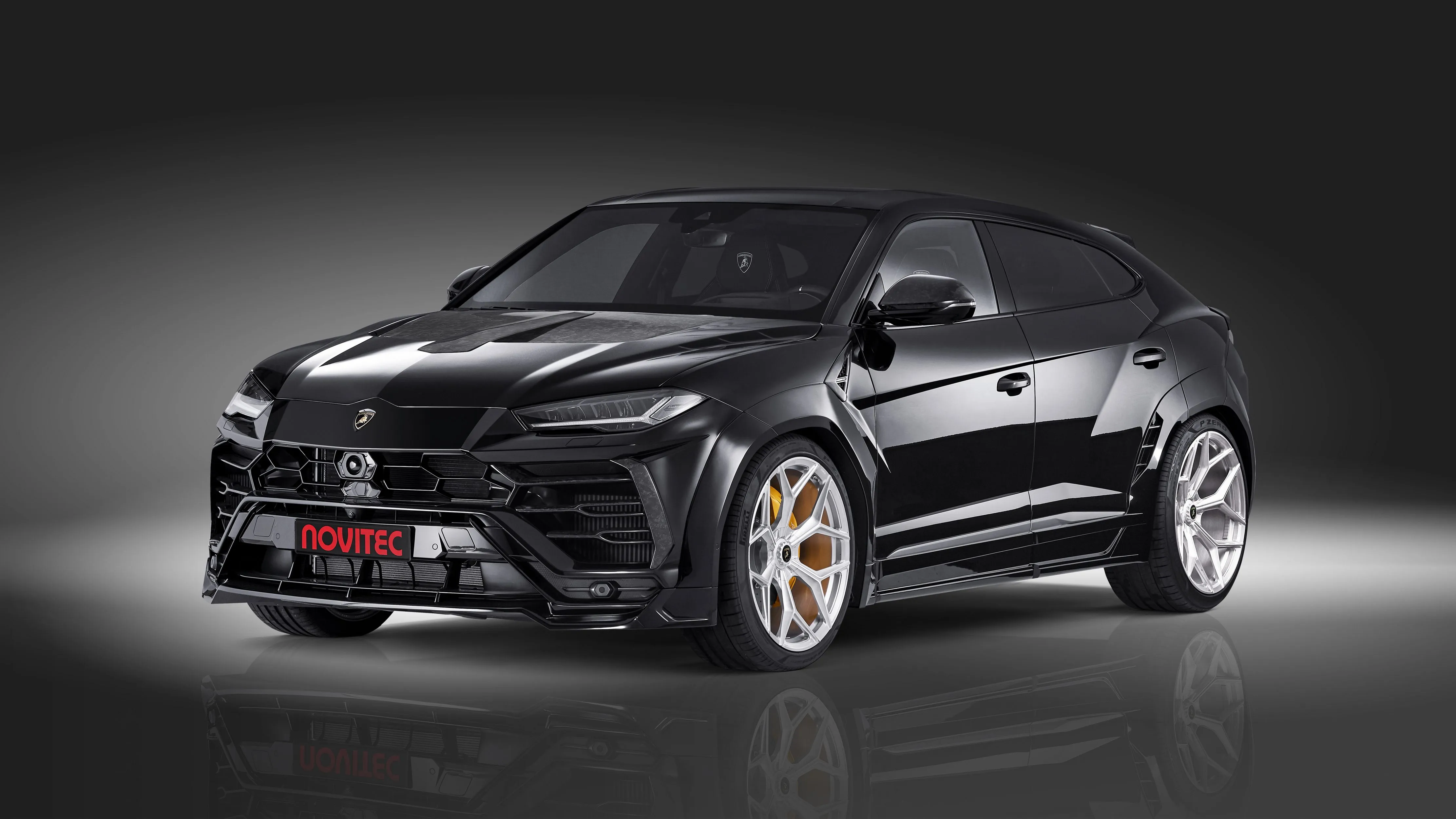 Black Lamborghini Urus Esteso 2019 on a gray background Desktop wallpaper 600x382