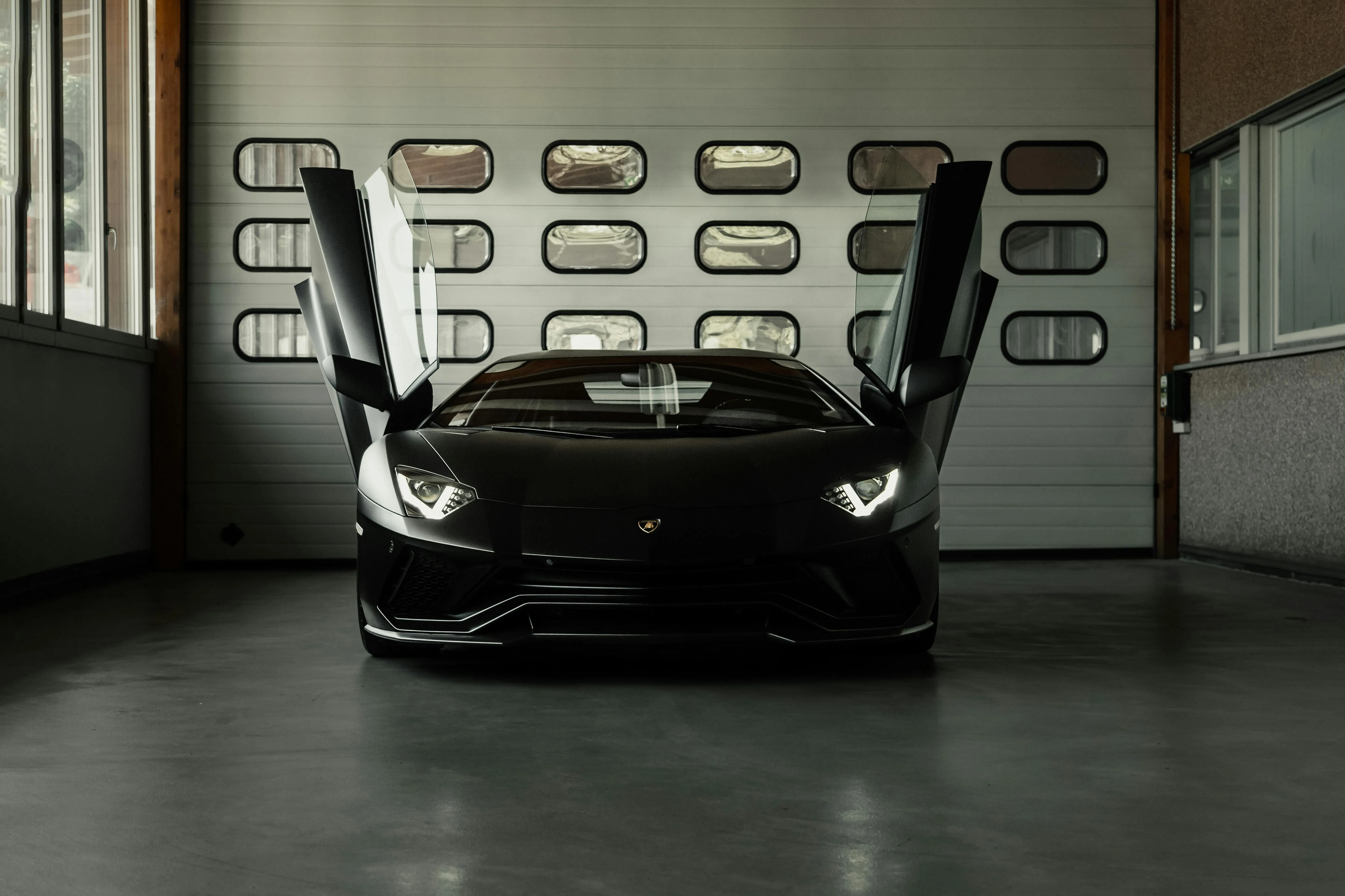 Luxury Black Car with Open Doors in Garage · Free