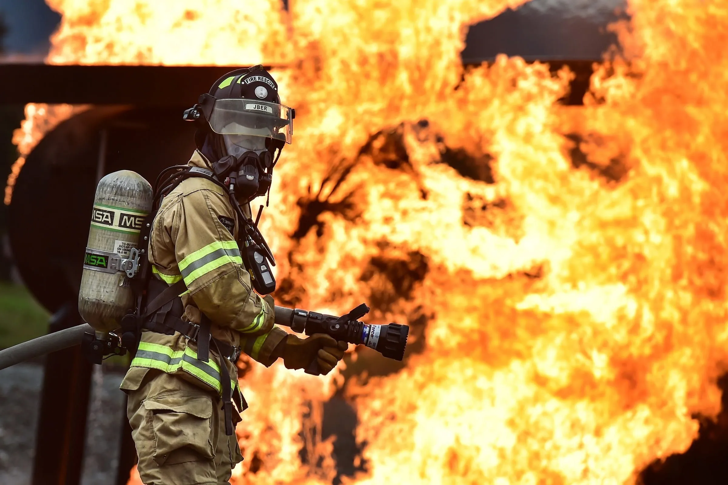 Royalty Free Photo: Fireman Catching Fire Wearing A Mask