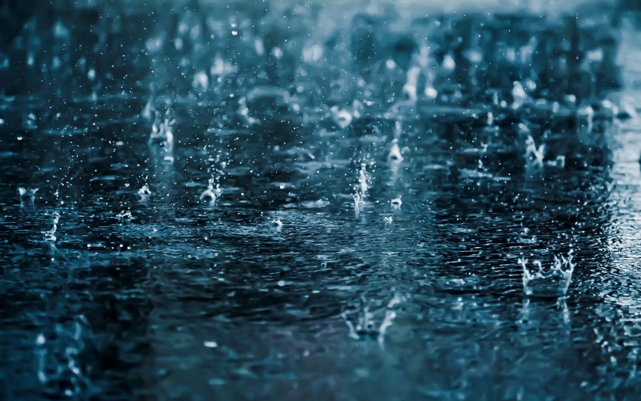 Raindrops Falling On A Dark Surface HD Wallpaper