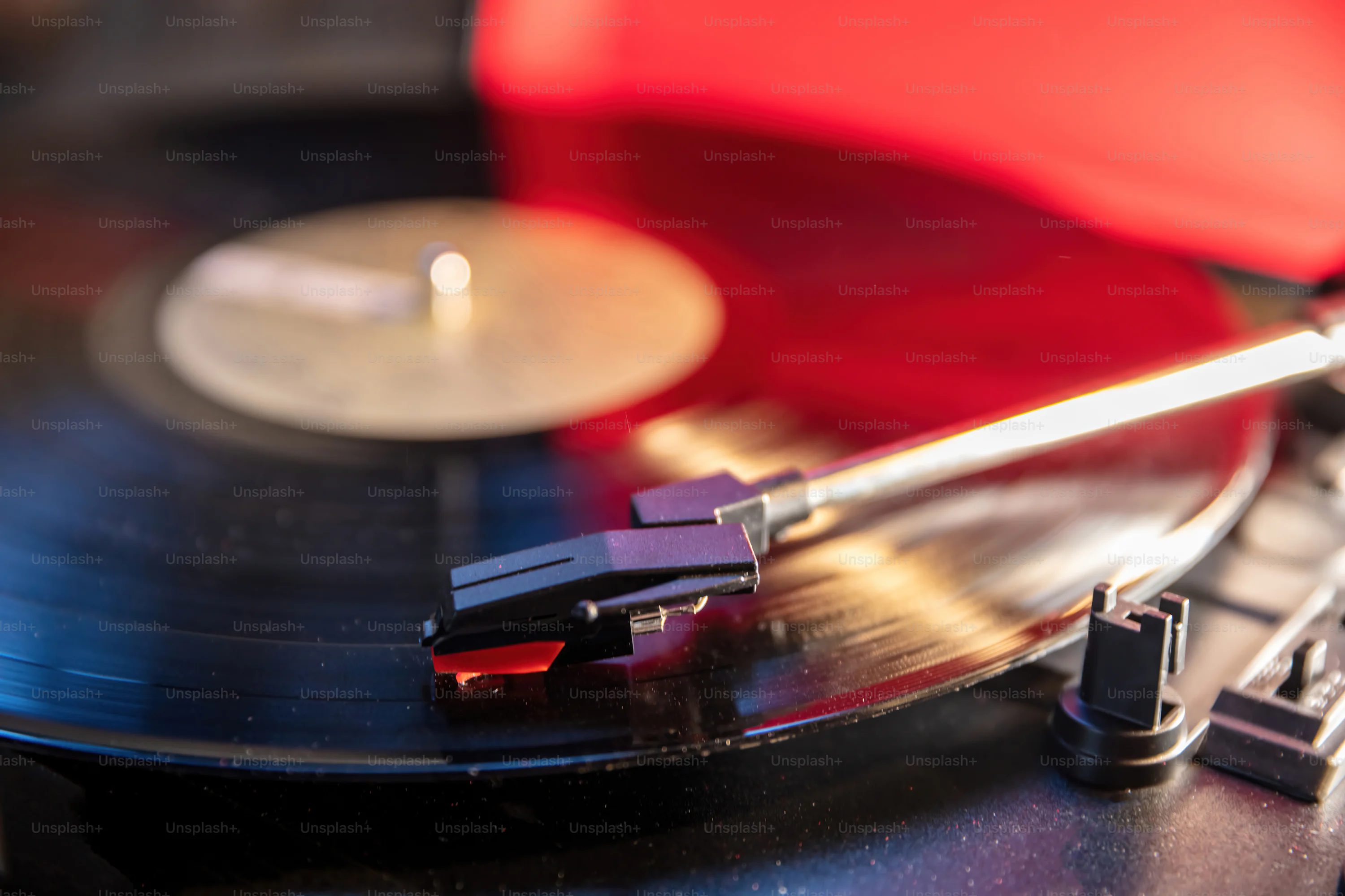Retro sound technology, play vintage party music. Turntable vinyl record player, disco neon light background. Needle on the disc, close up view+