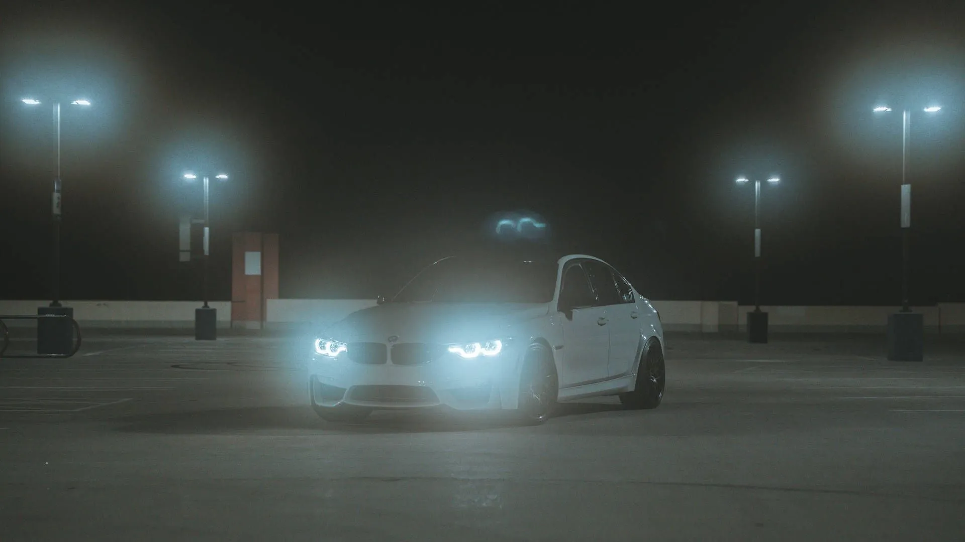 Download Parked BMW M Headlights On Wallpaper
