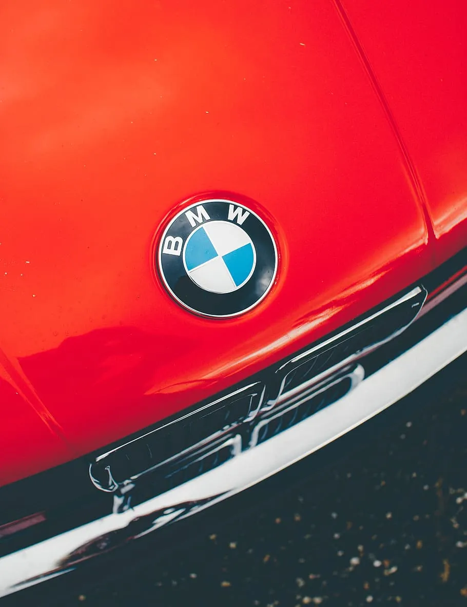 HD wallpaper: red BMW car, headlight, classic car, emblem, grill, shiny, closeup