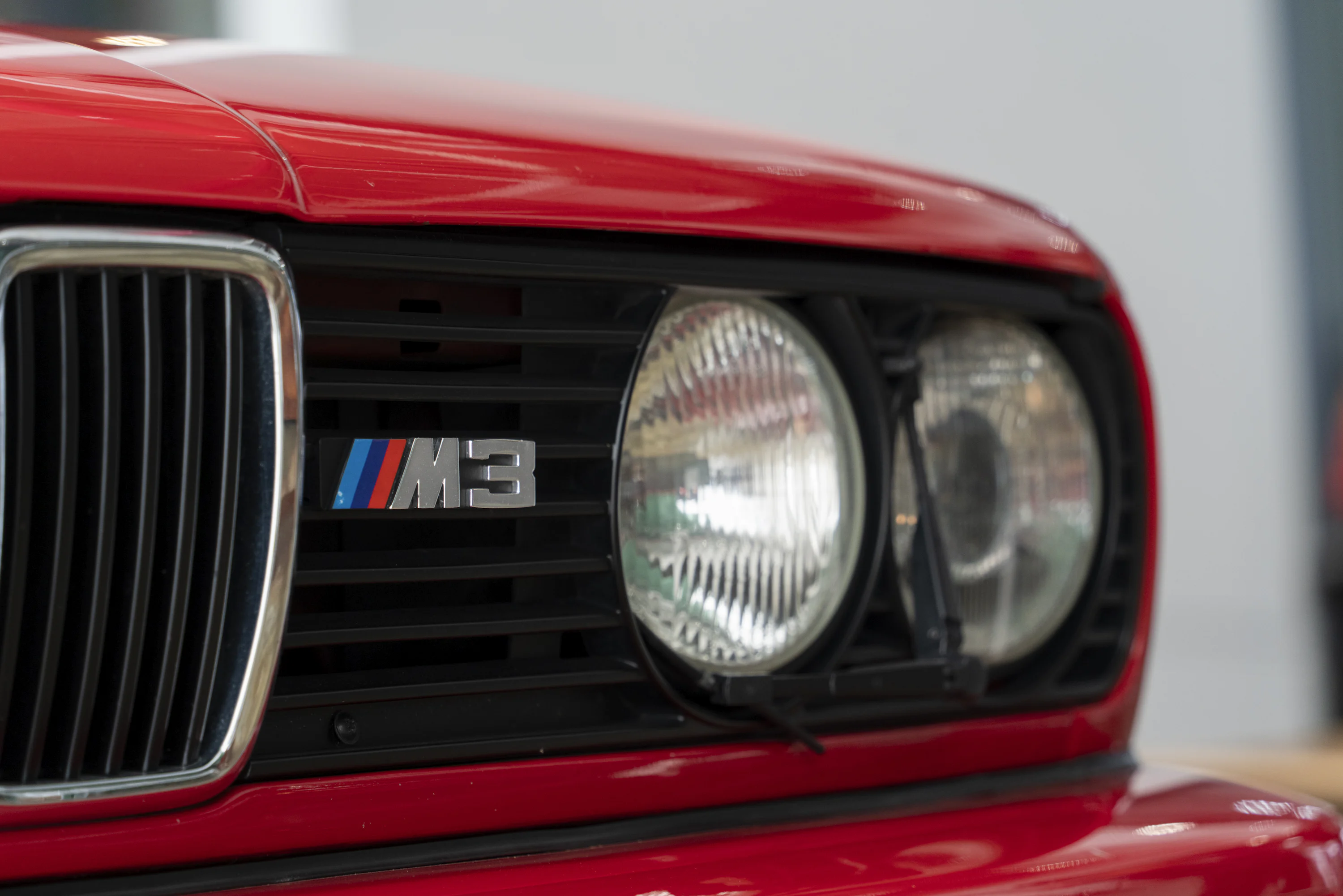 A close up of the front of a red car photo