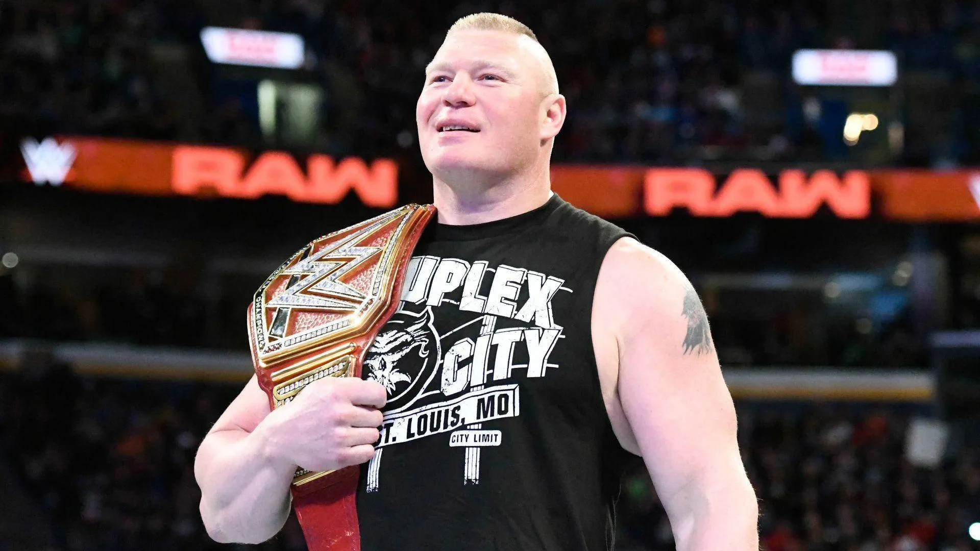 Download Powerhouse WWE Athlete, Brock Lesnar, in Action Wallpaper