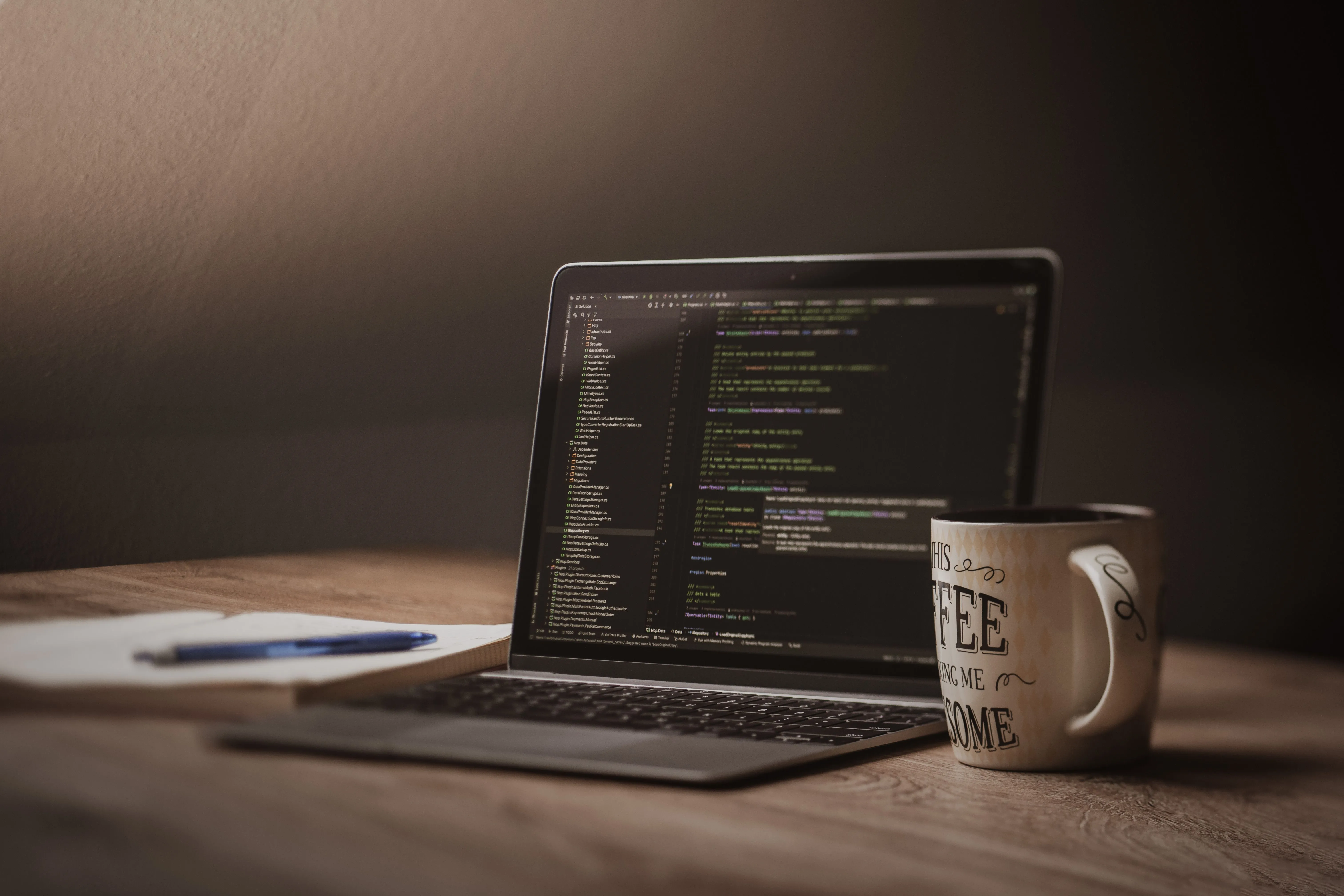Cozy Workspace with Coding on Laptop Screen · Free