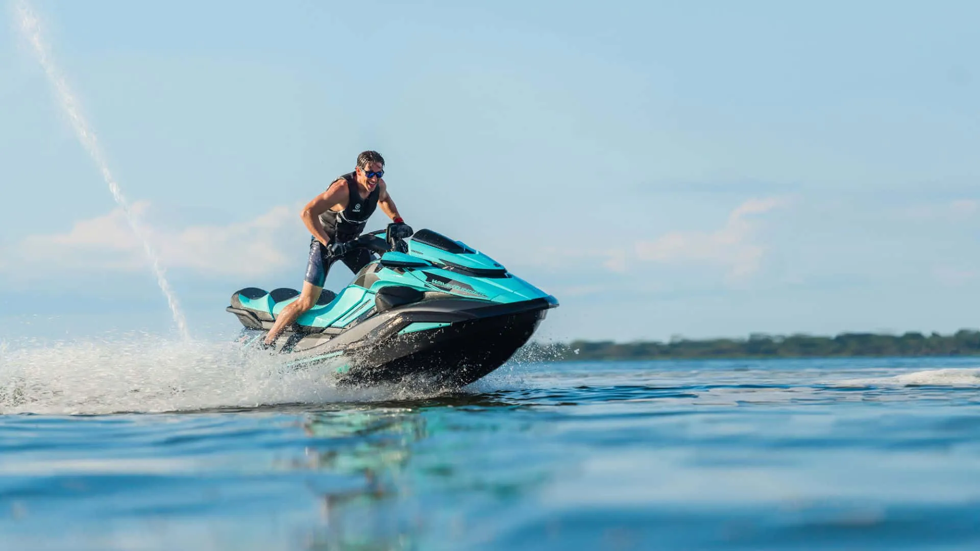 Download A Striking Blue and Black Jet Ski, Gliding Seamlesslyer Wallpaper