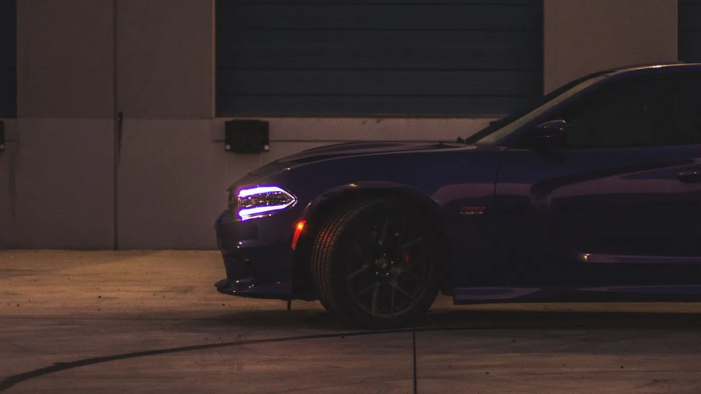 Download wallpaper 1366x768 dodge charger, side view, headlight, purple tablet, laptop HD background