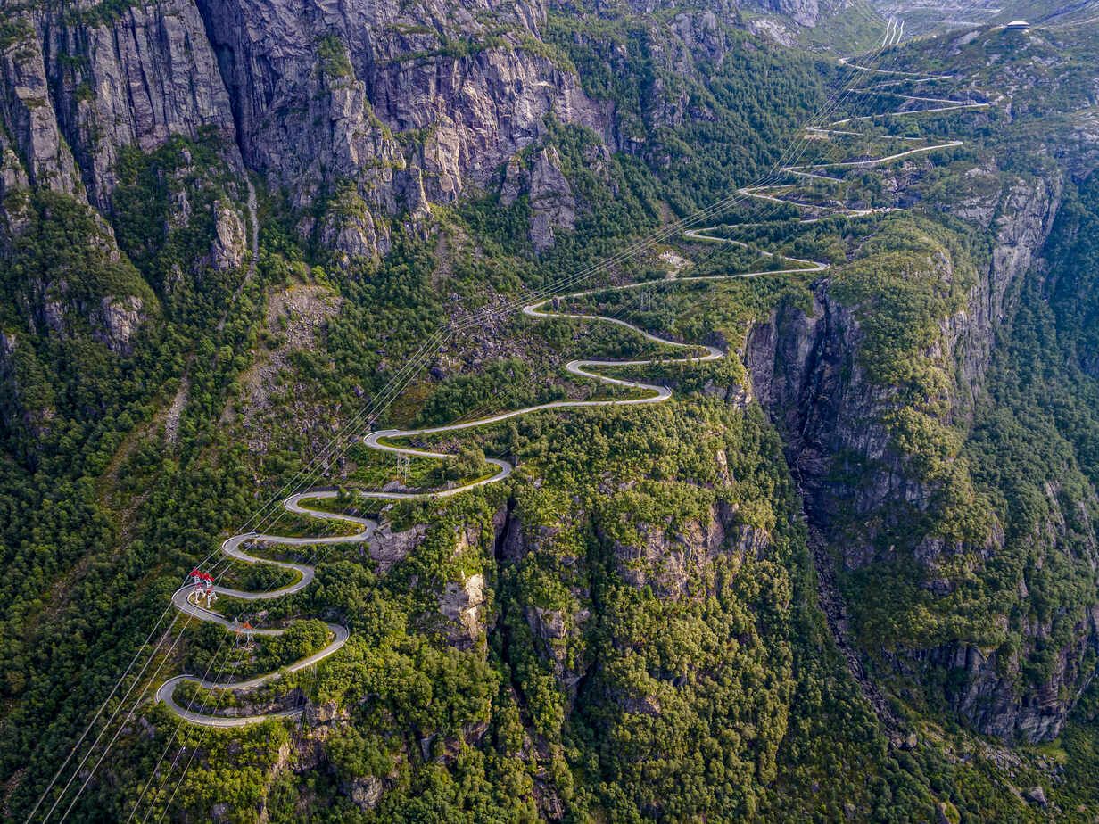 Norway, Rogaland, Lysebotn, Aerial view of cable cars and road winding along steep cliff