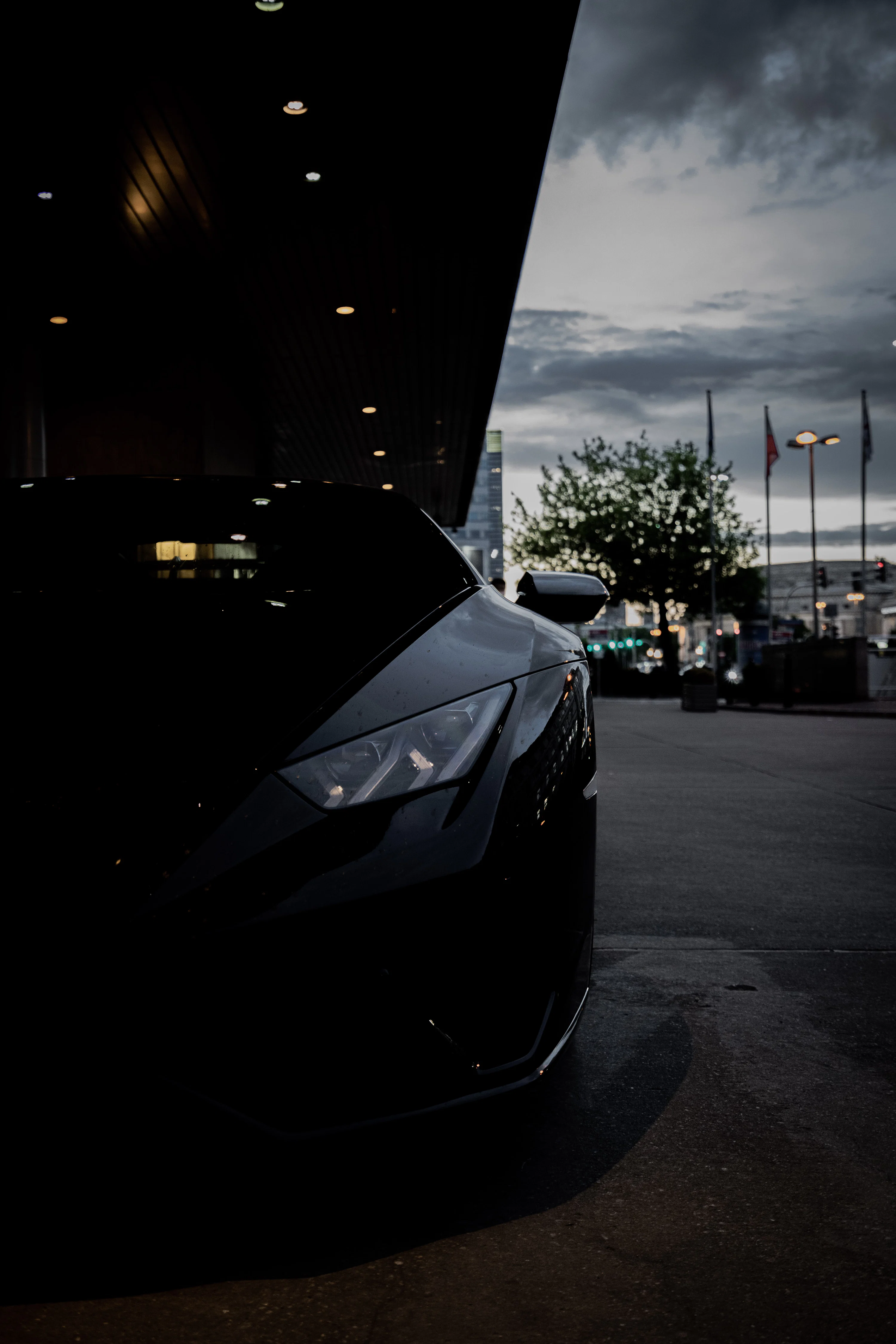 A black sports car parked in a parking lot photo