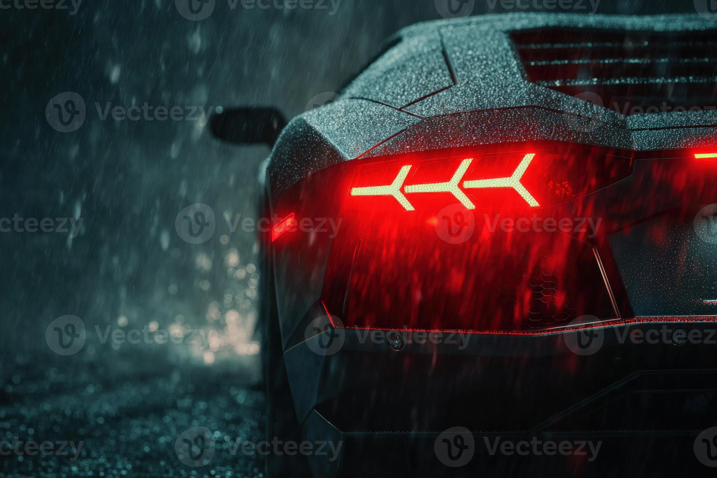 Moody black Lamborghini illuminated by red lights in heavy rain at night