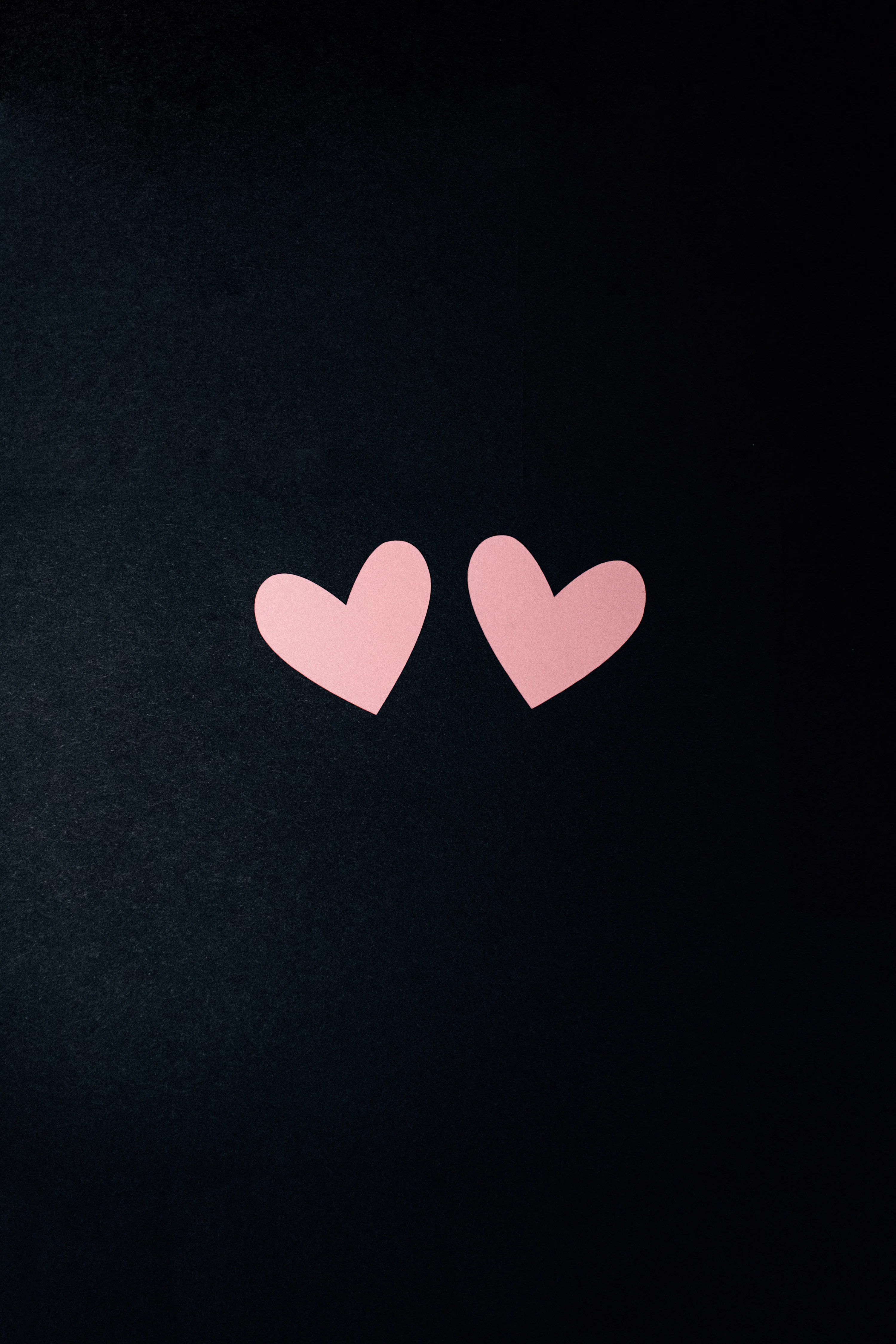 Black and pink heart print textile photo