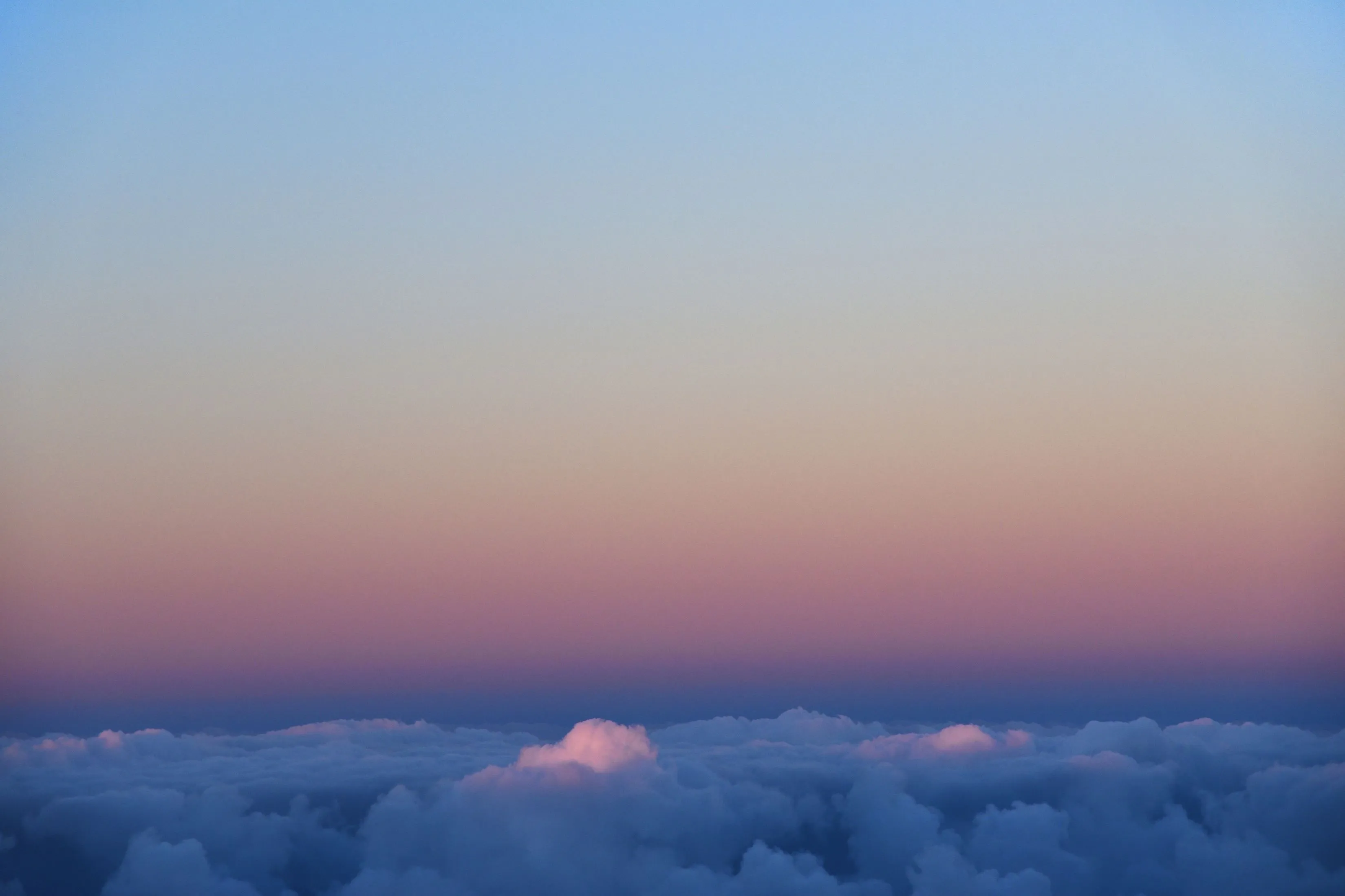 Sunset View From Plane Window Above The Clouds