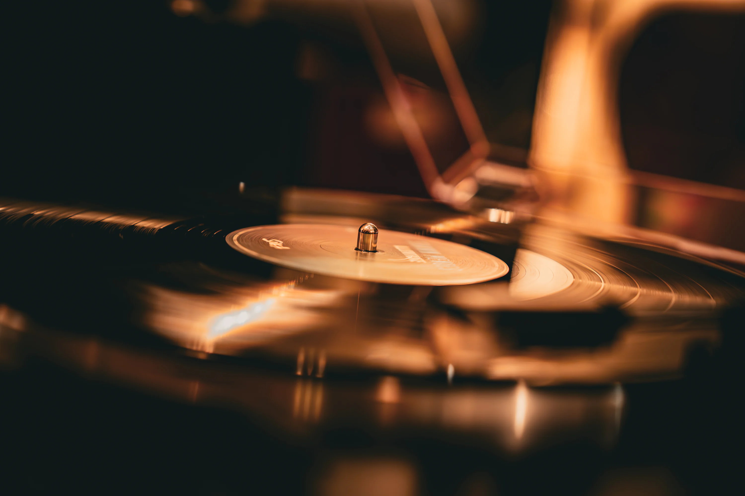 A vinyl record spins on the turntable