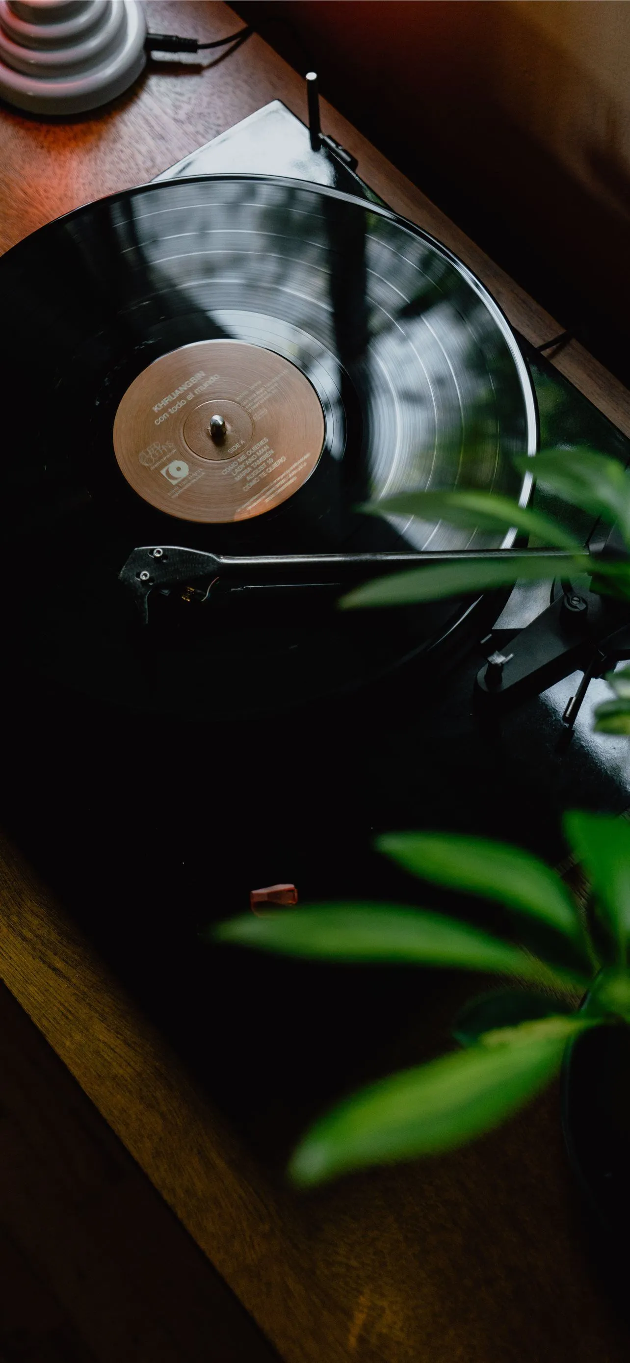 black turntable on brown wooden table iPhone Wallpaper Free Download