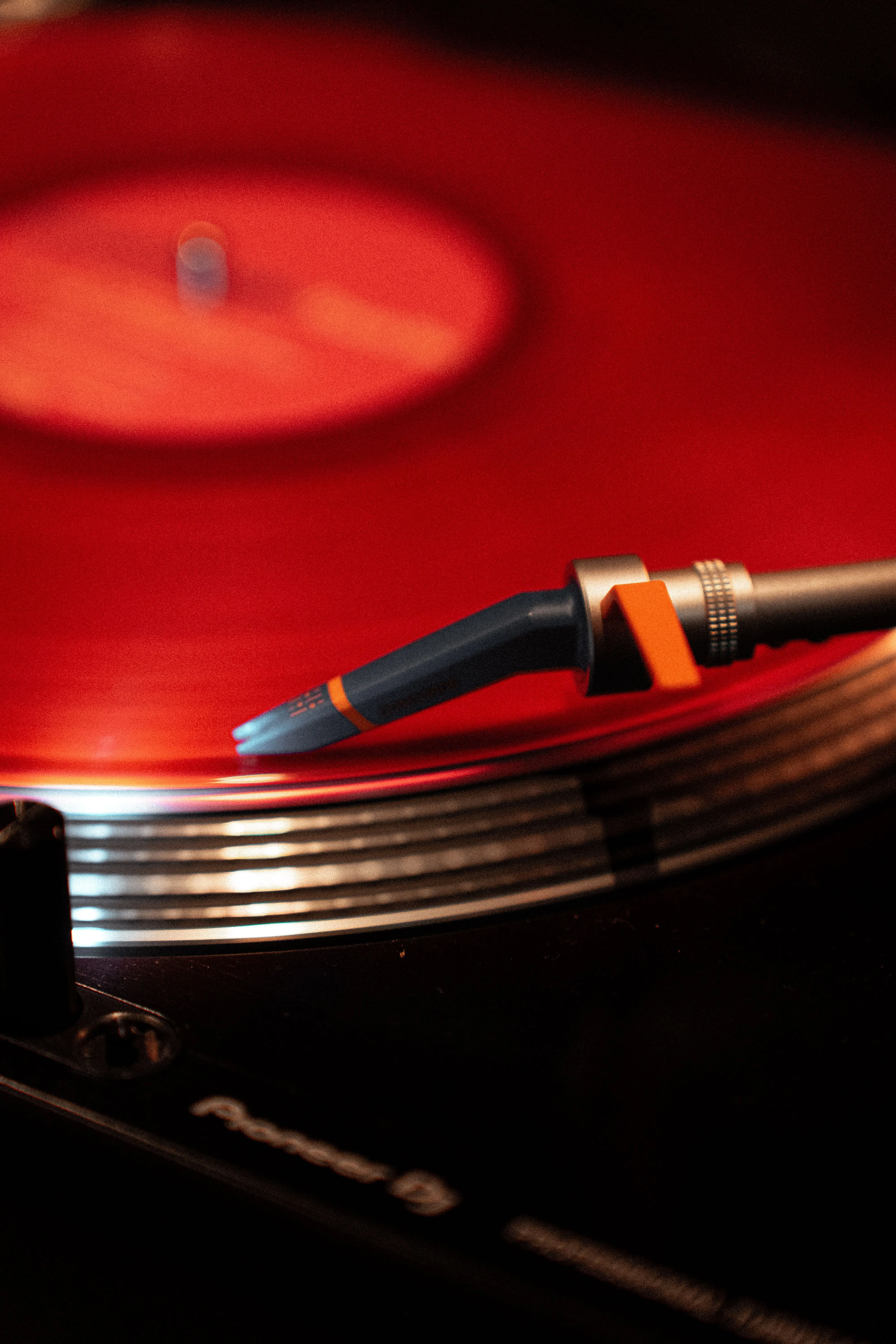 Close Up Of Red Vinyl Record Spinning On Turntable · Free