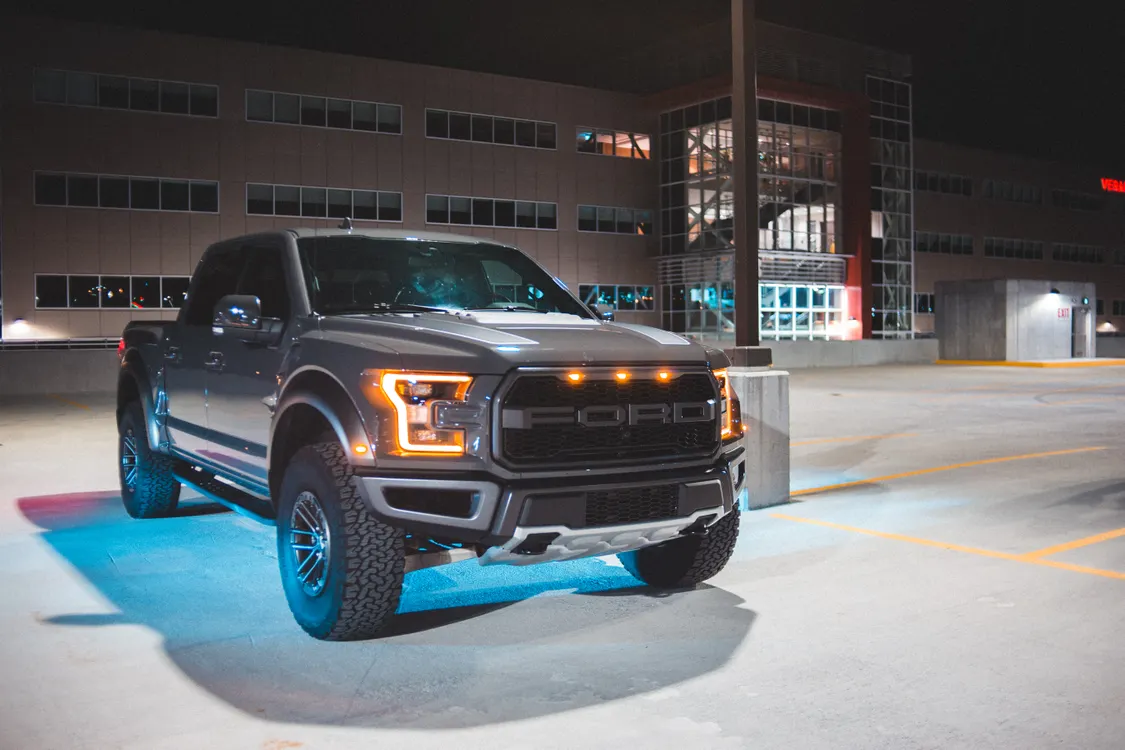 Pickup truck with neon light parked on street · Free