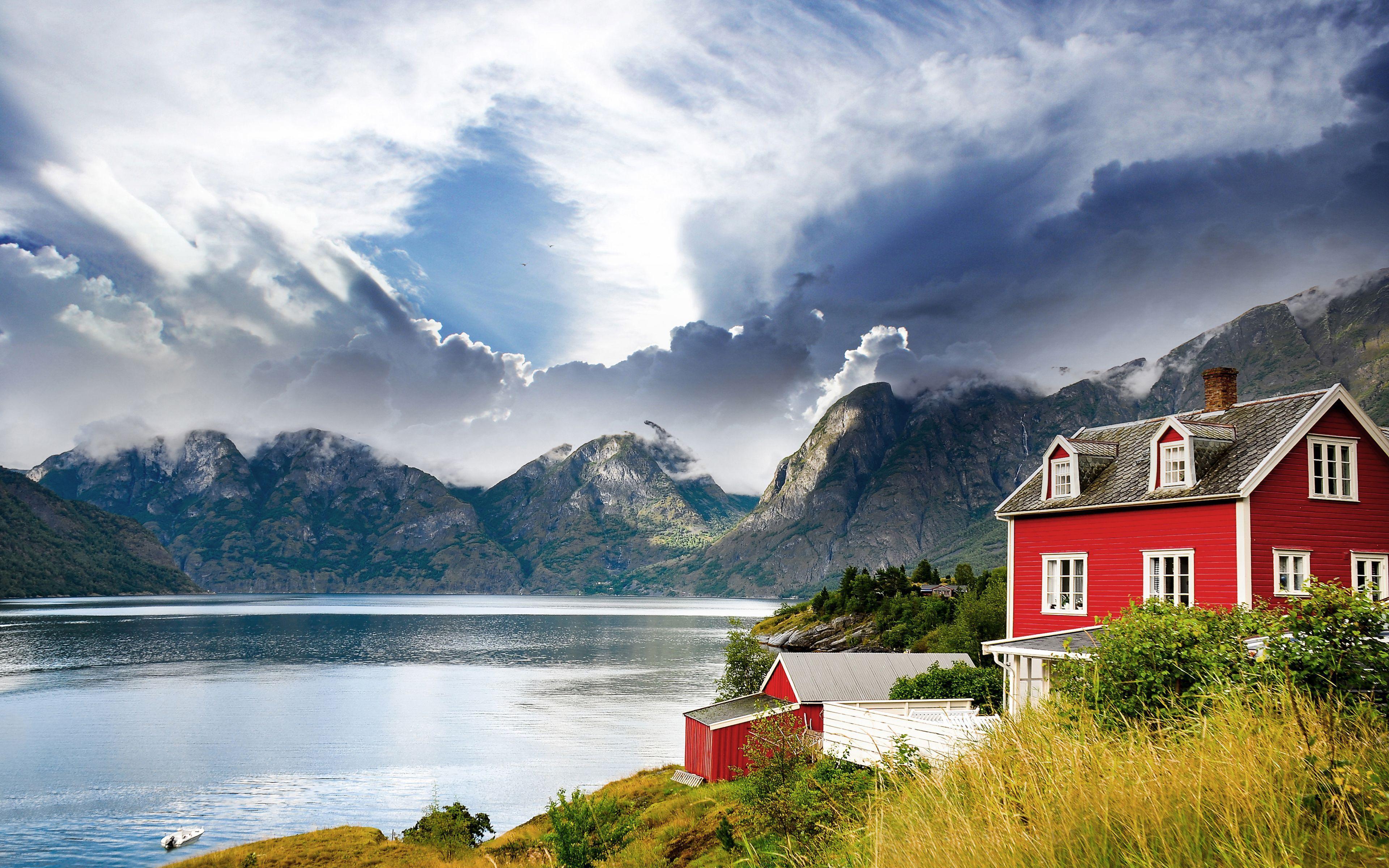 Beautiful house on a background of mountains in Norway wallpaper