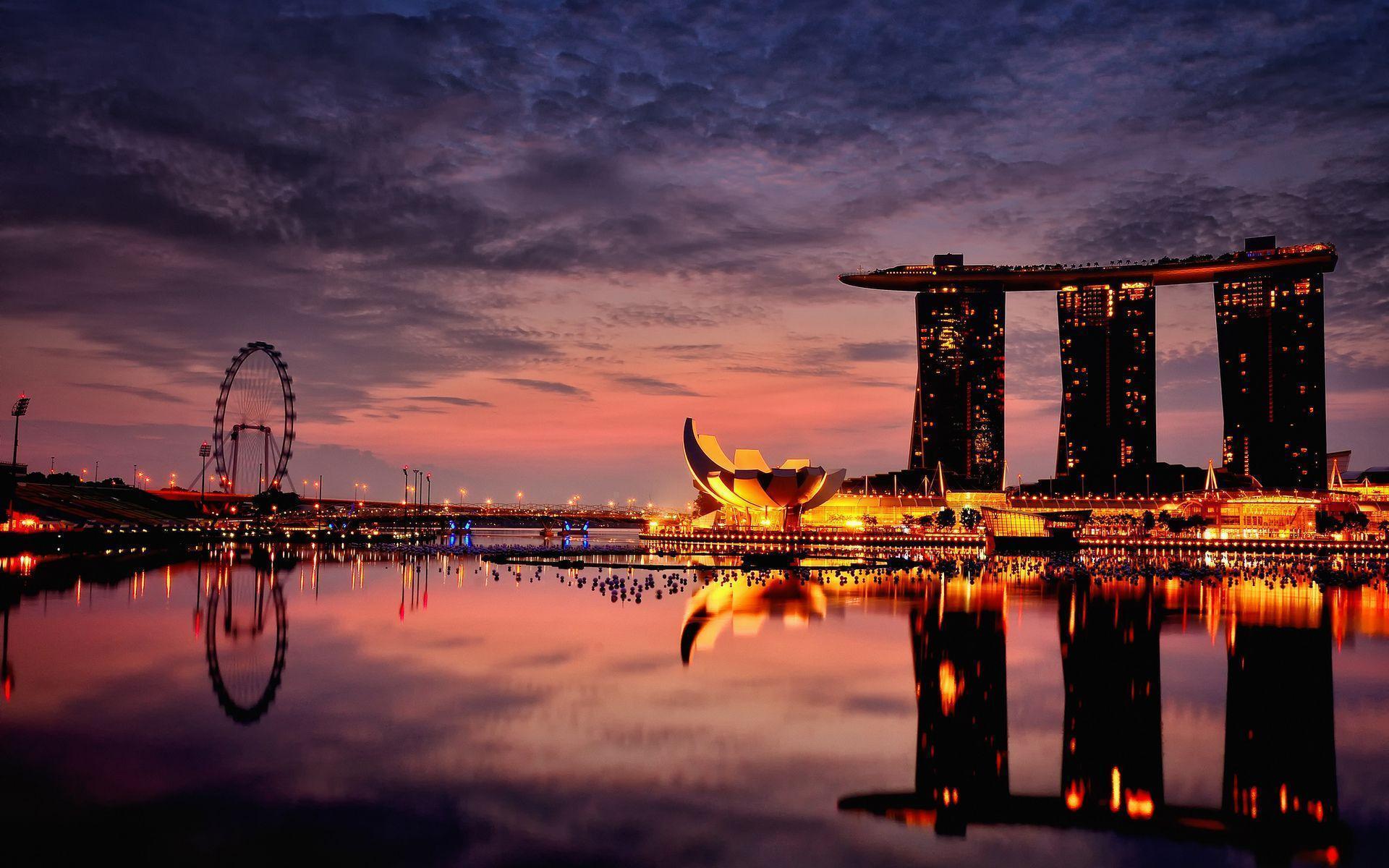 Relaxing view of Singapores reflection in the water at night 4K wallpaper  download