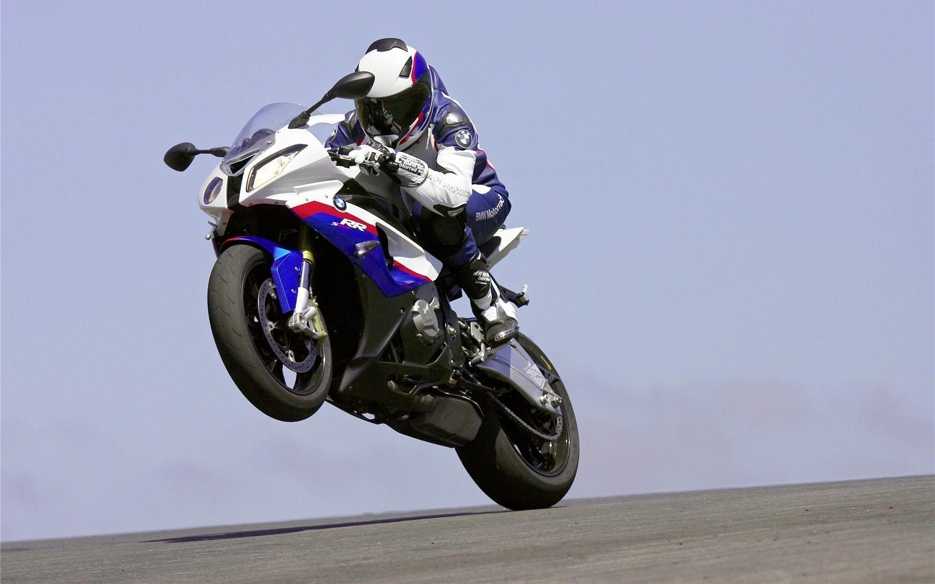 Racer on wheelie BMW S 1000 RR wallpaper and image