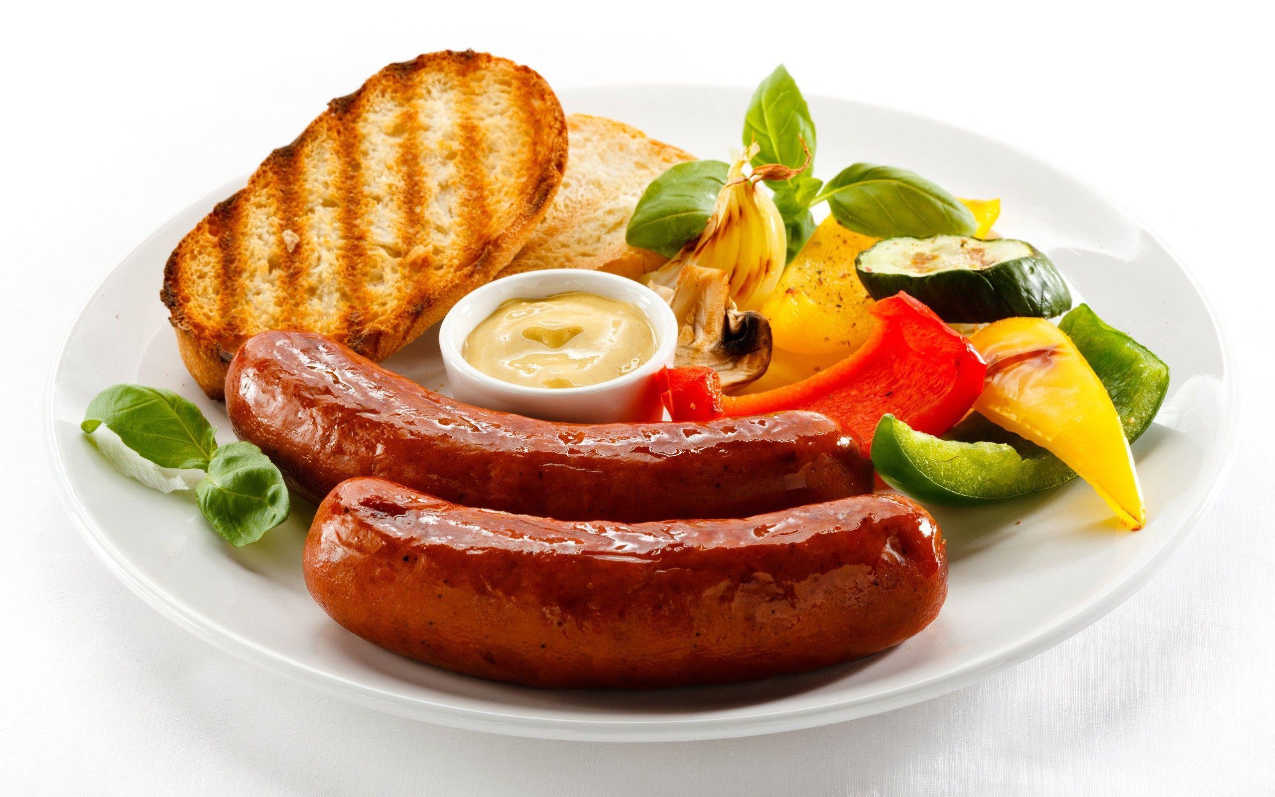 Two sausages for a breakfast wallpaper and image