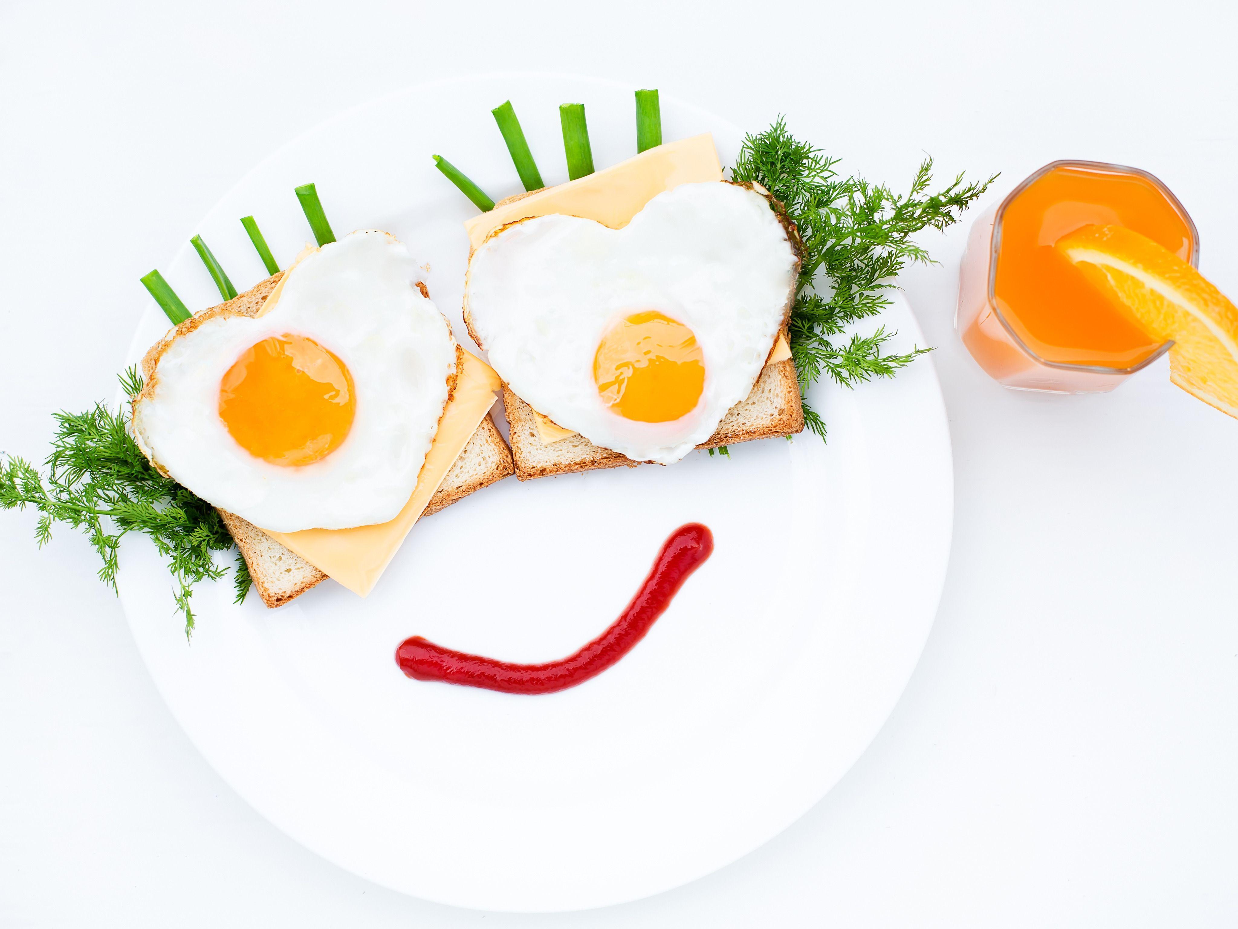 Happy Breakfast, Heart Shaped Eggs on Toast and Cheese, Fresh Orange