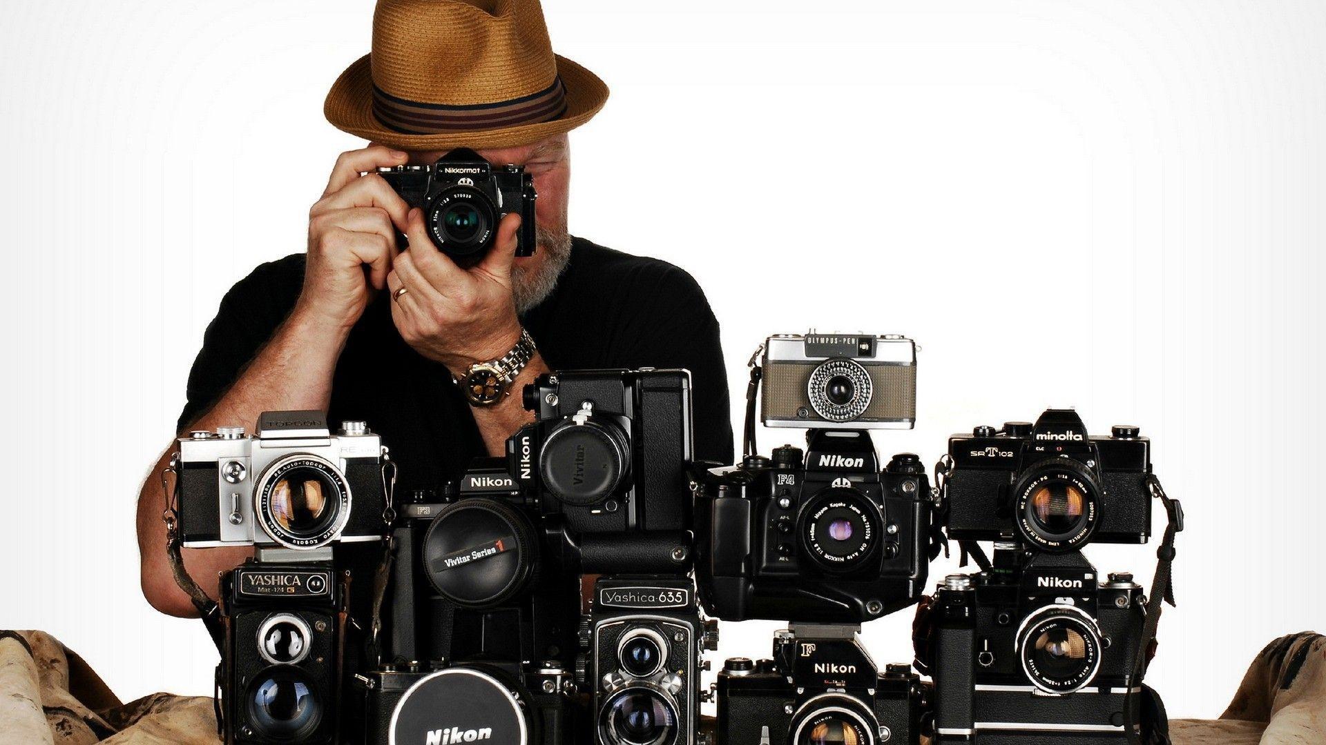 Photographer with cameras Nikon wallpaper and image
