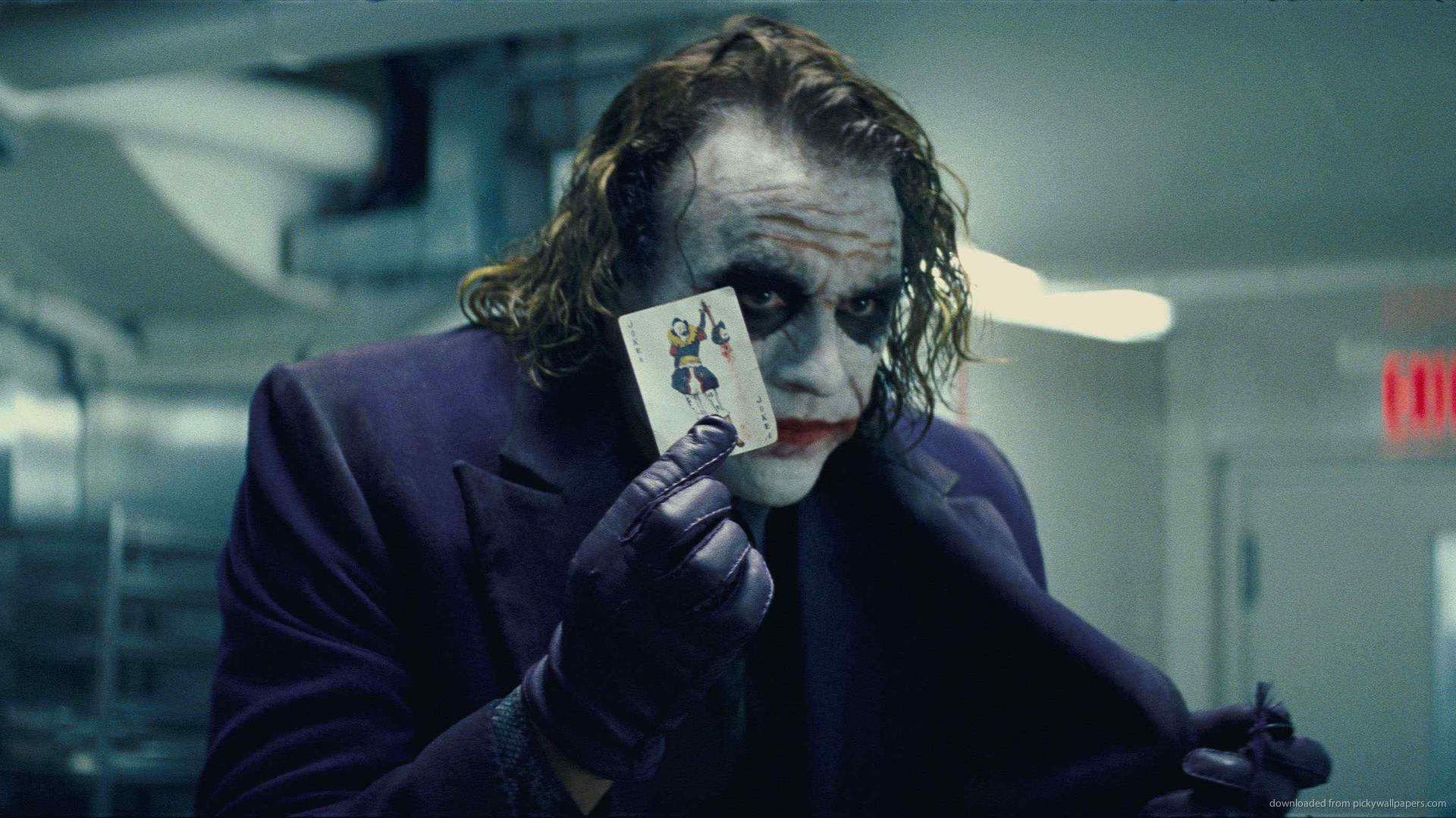 Download Joker Holding Card Wallpaper | Wallpapers.com