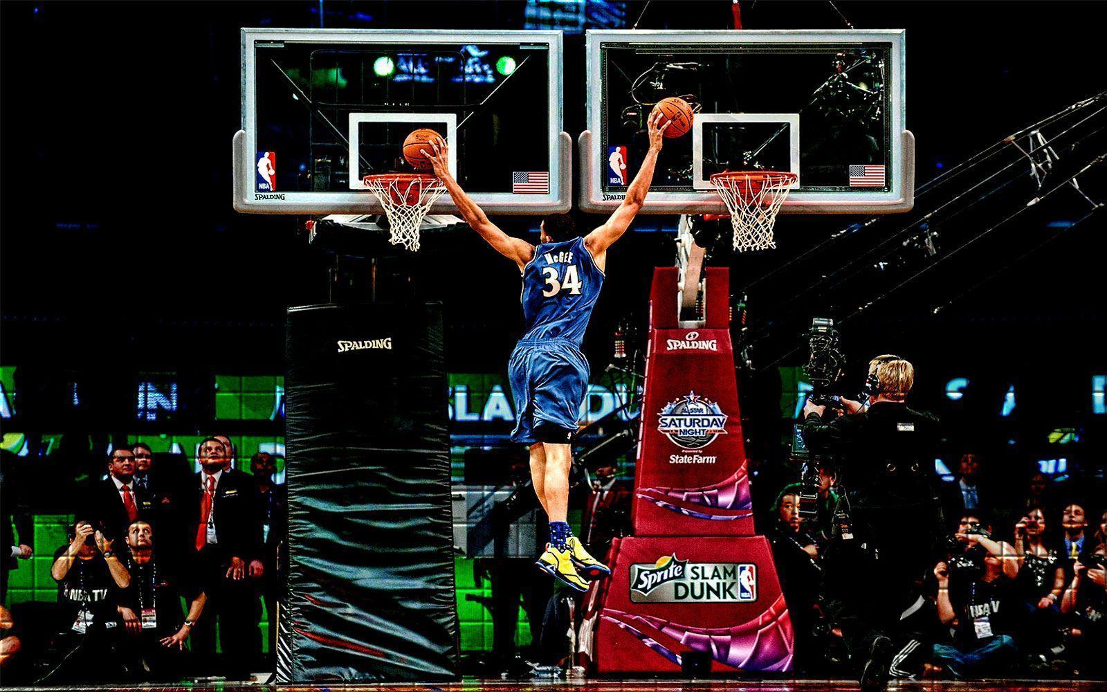 Download A Basketball Player Is Dunking Wallpaper