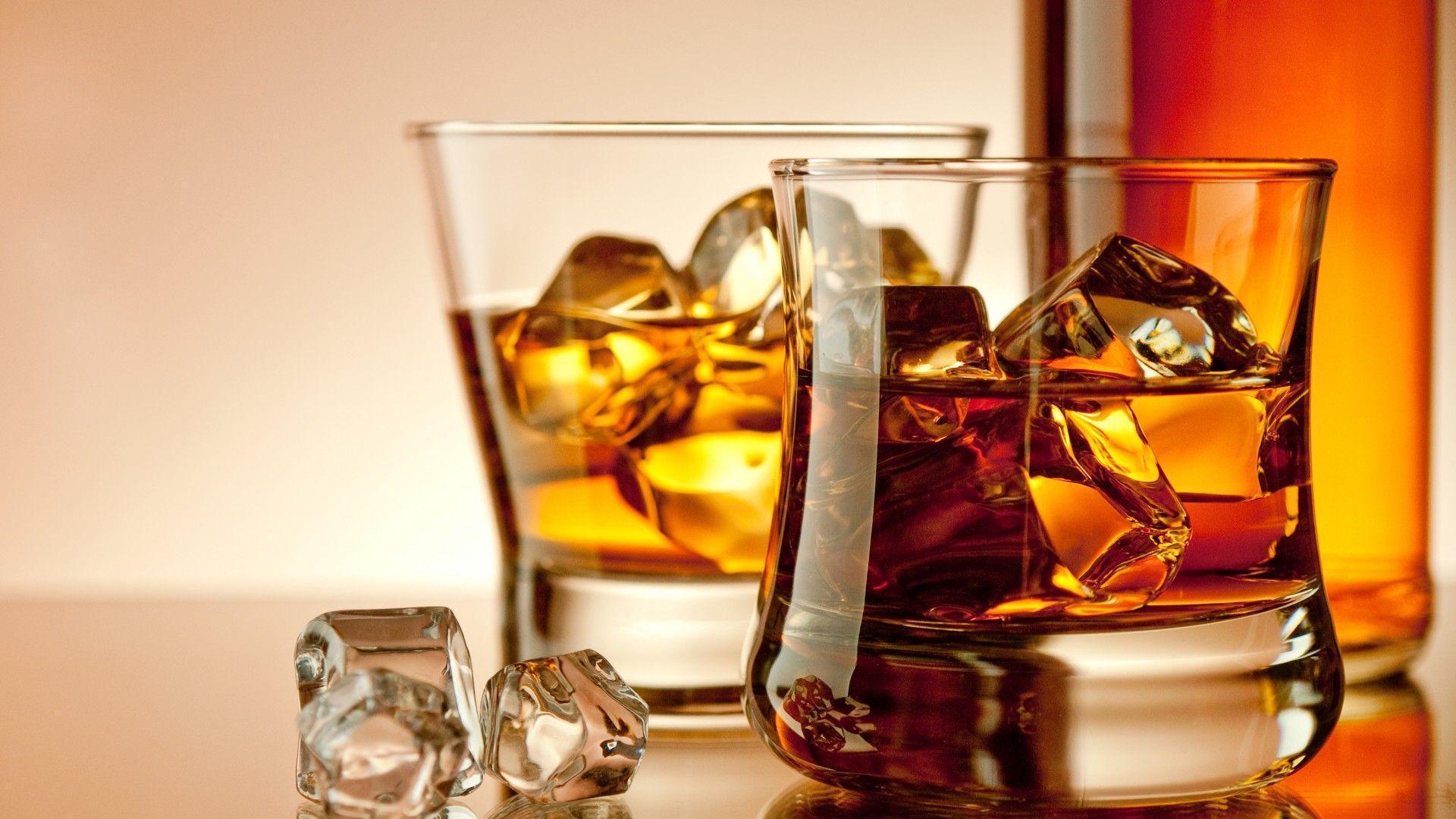 Whiskey drink alcohol glasses bottles ice cubes drinks wallpaper