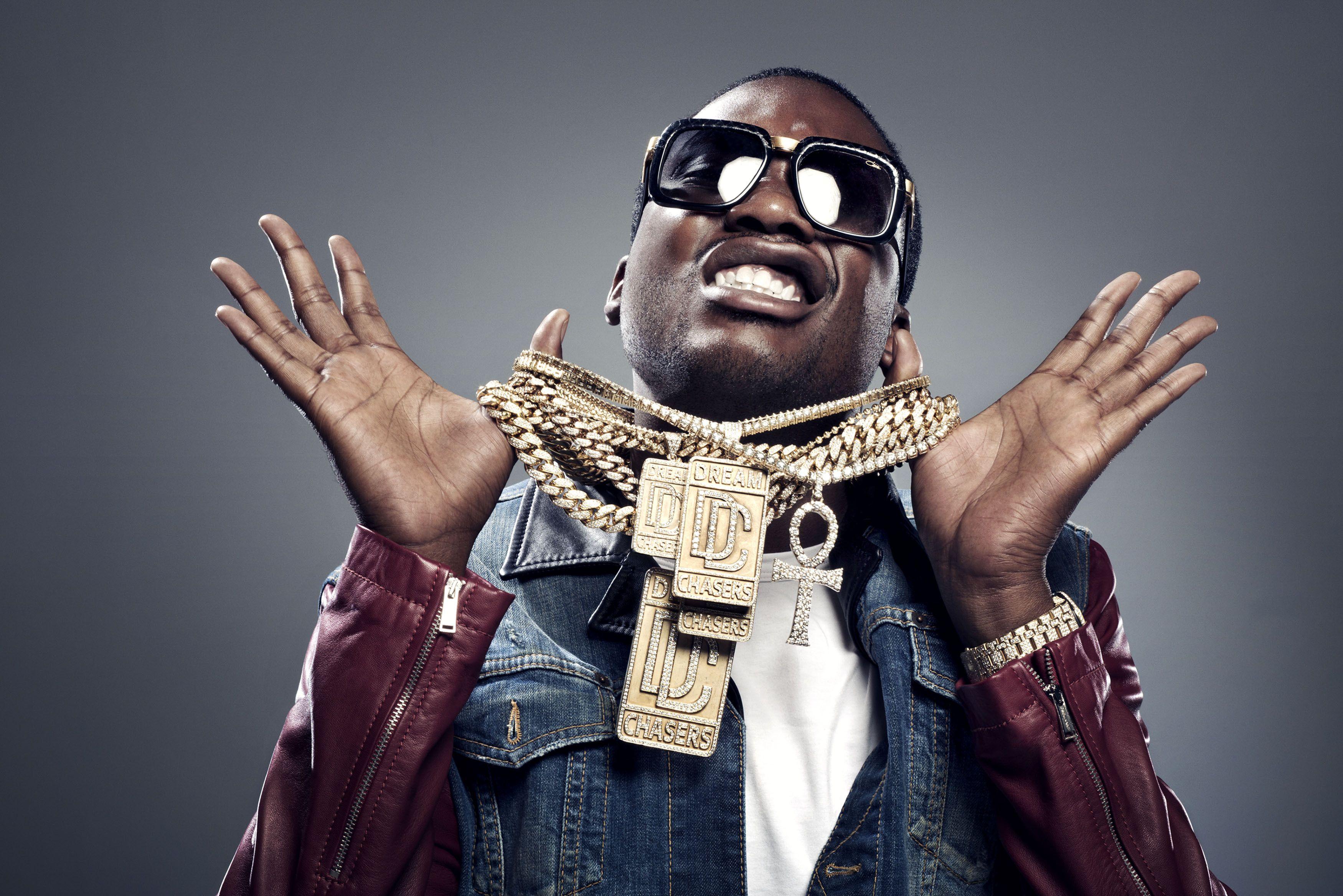 Download Meek Mill Posing on a Grand Staircase Wallpaper
