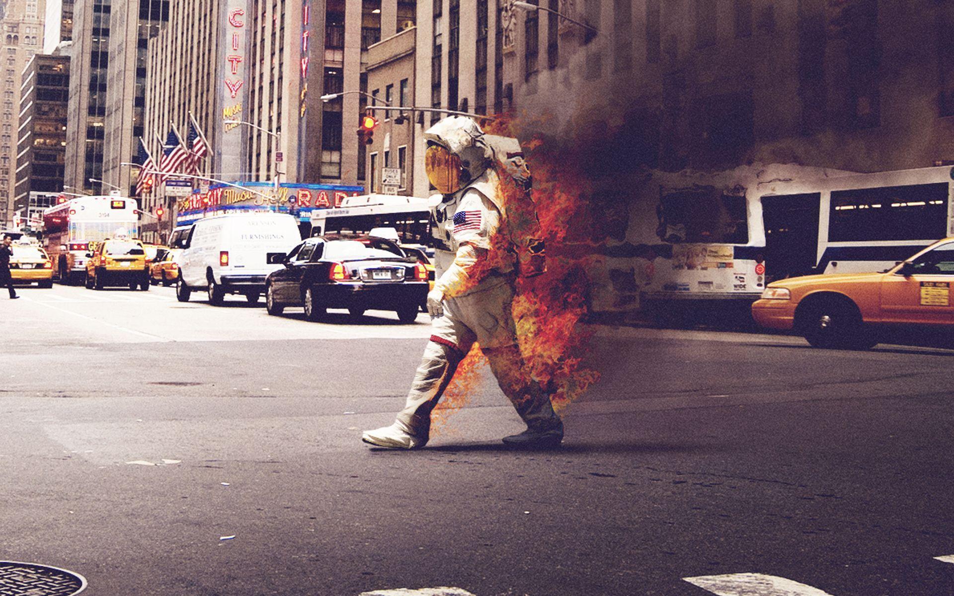 Astronaut on Fire walking down a street