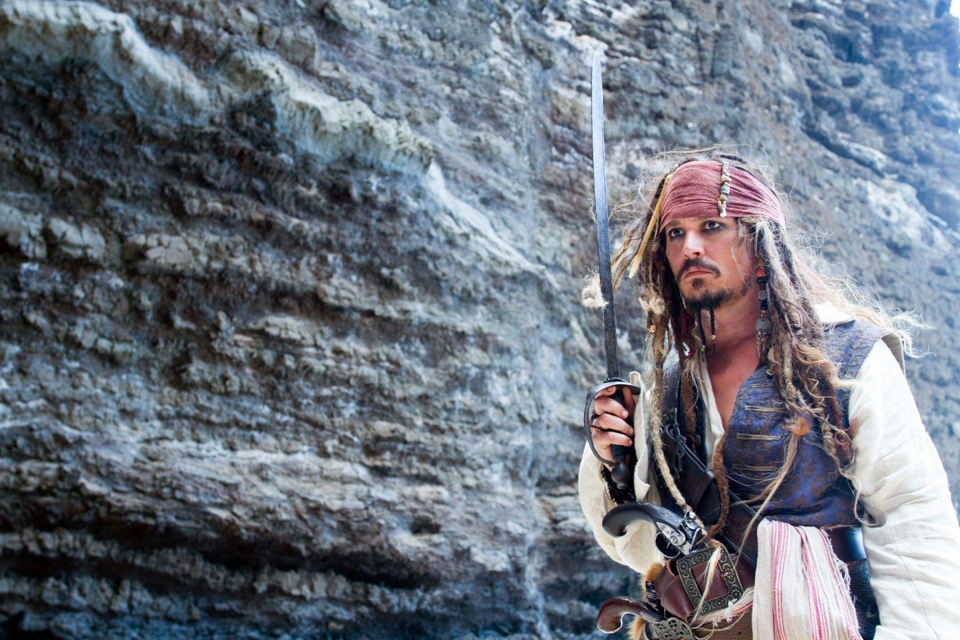 johnny depp actor captain jack sparrow sword rock pirates