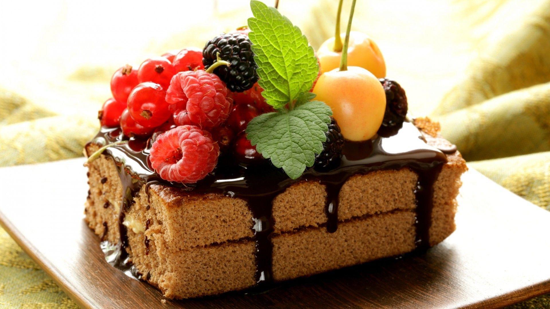 Fruits and berries on a chocolate biscuit wallpaper and image