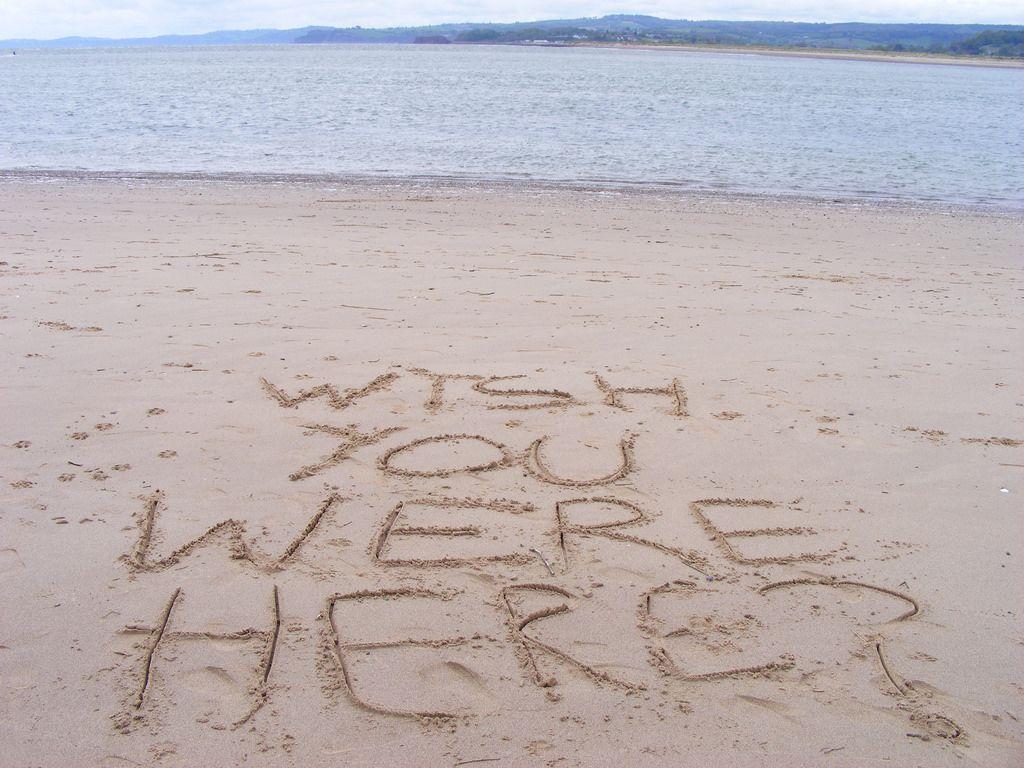 Wish you were here?. Walking along the beach at Exmouth, fo