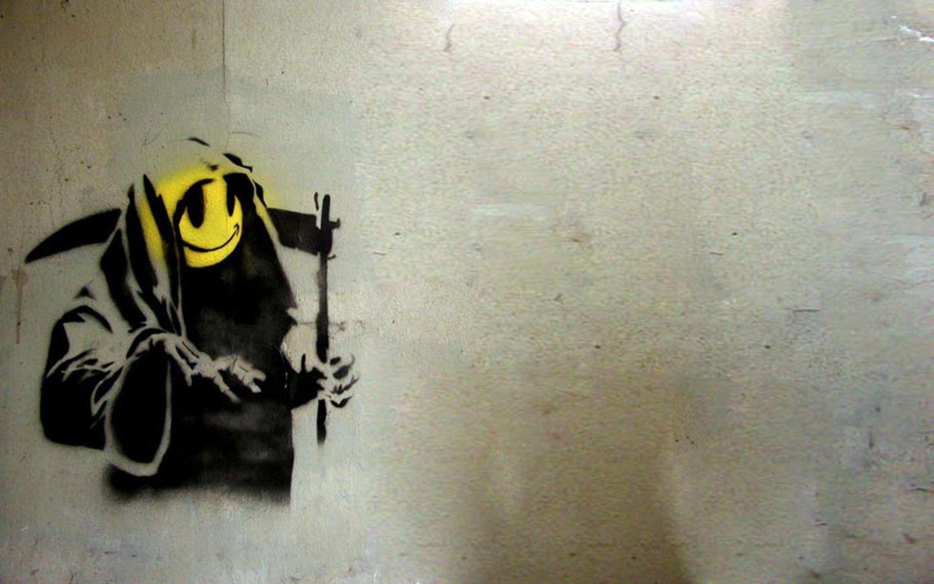 Grim reapers smiley face spray paint wallpaper