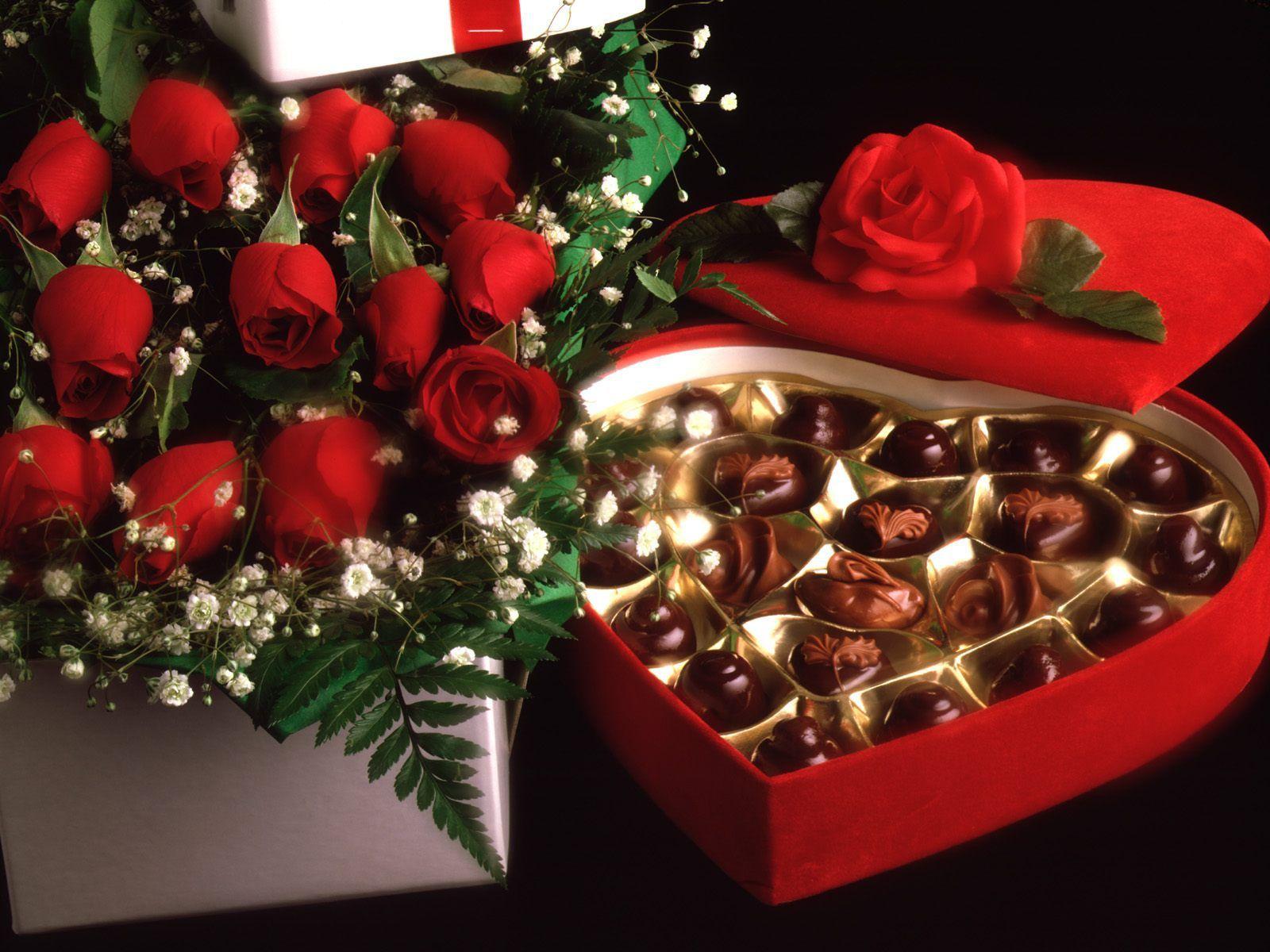Red roses on March 8 with chocolates wallpaper and image