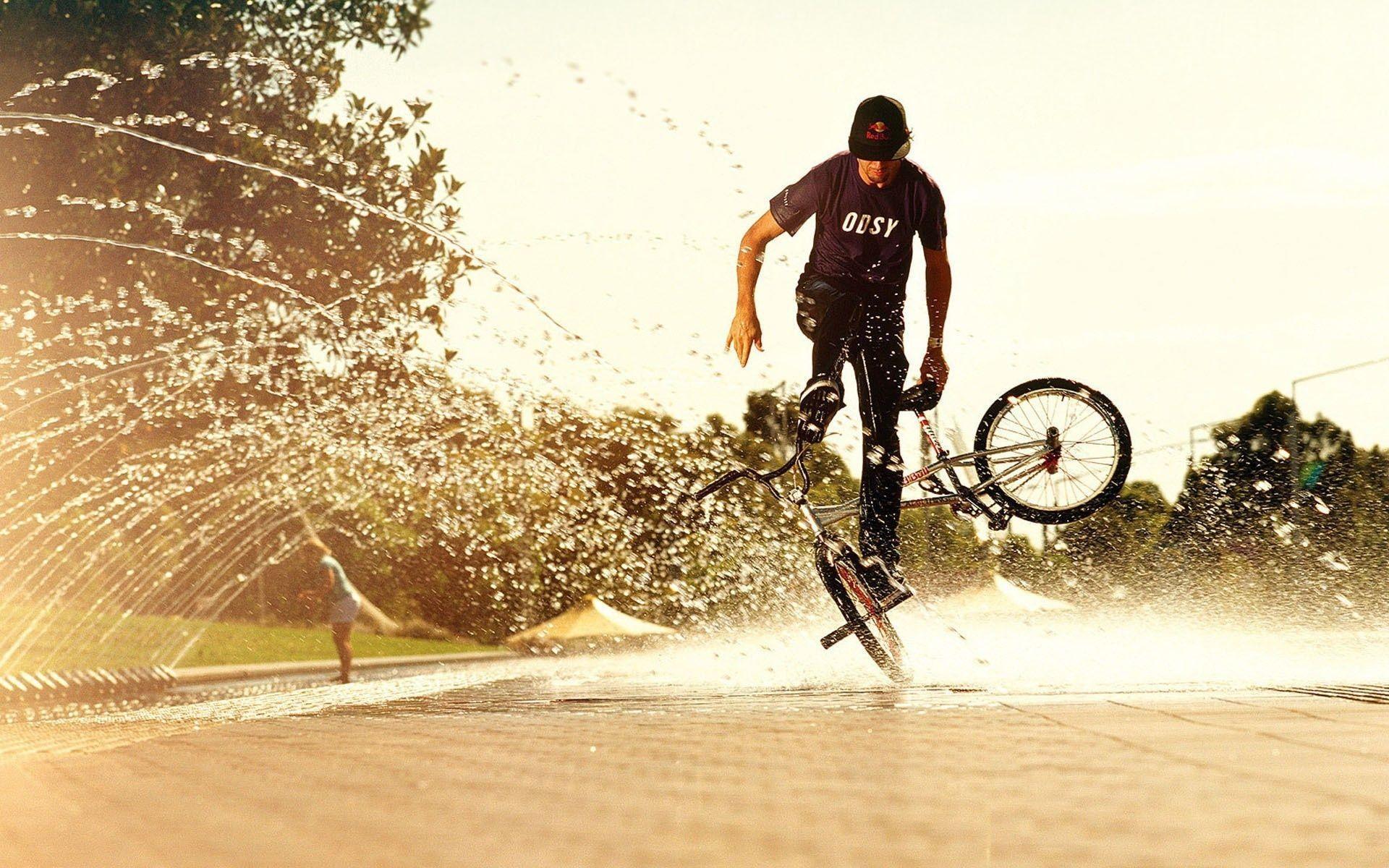 Man Bikecycle Skills In Water Wallpaper