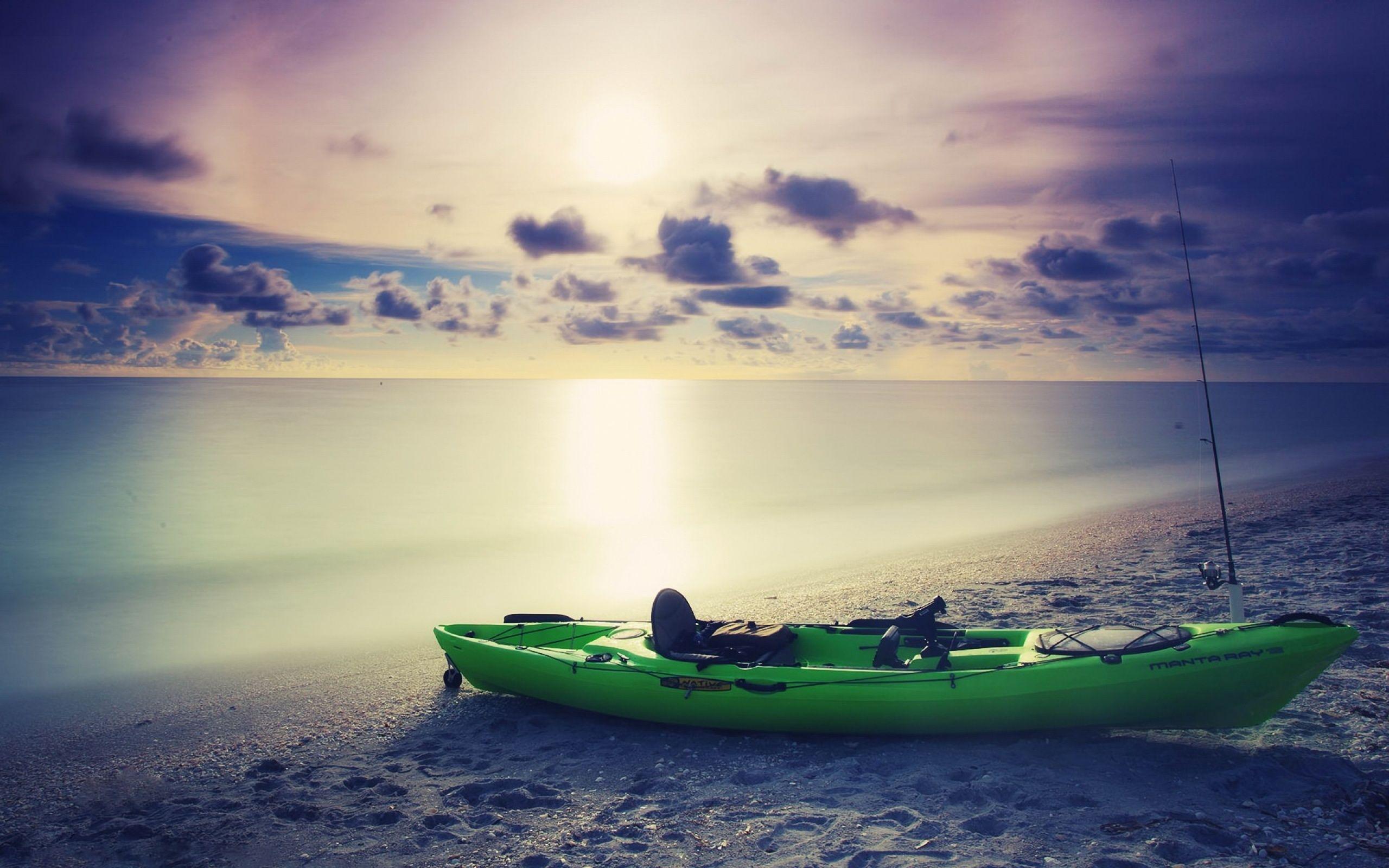Green Kayak on the beach. Photo and Desktop Wallpaper