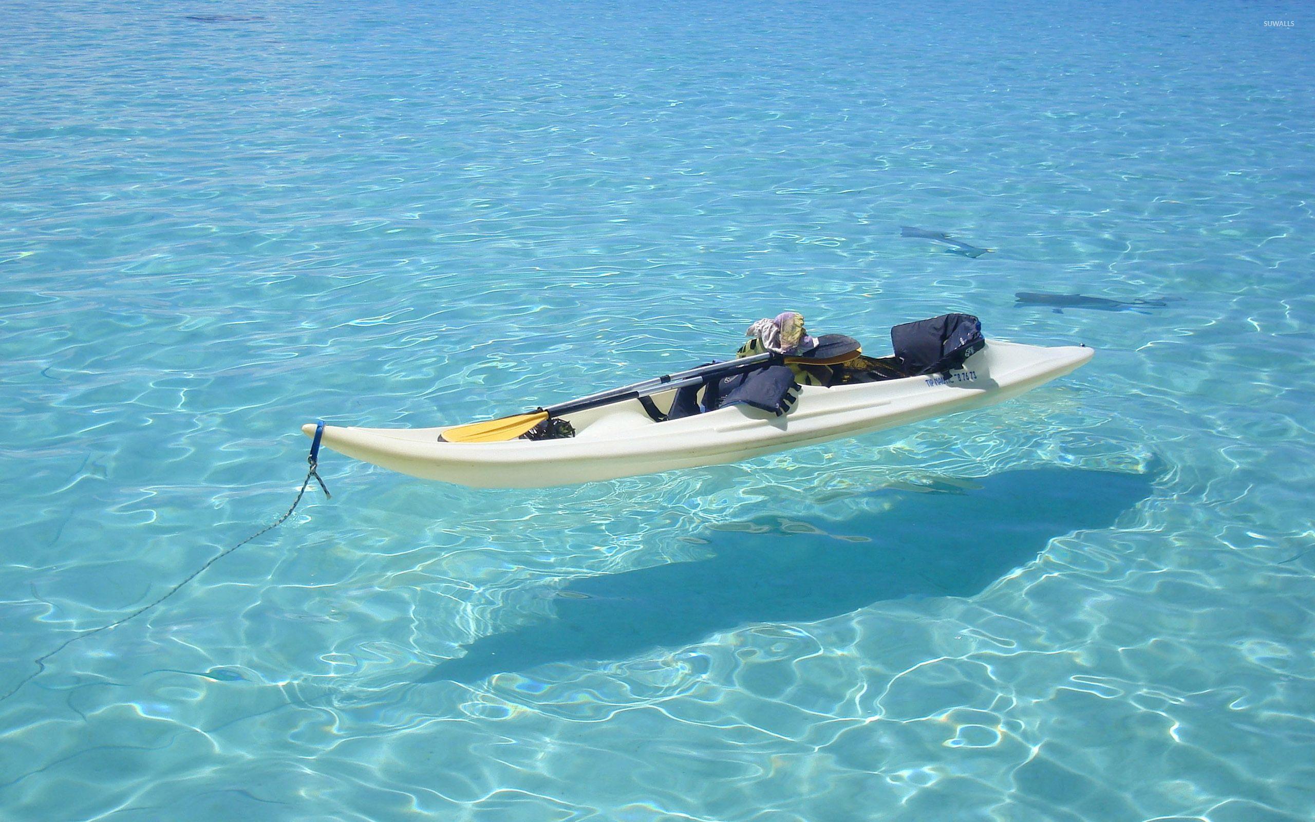 Kayak on clear ocean water wallpaper wallpaper