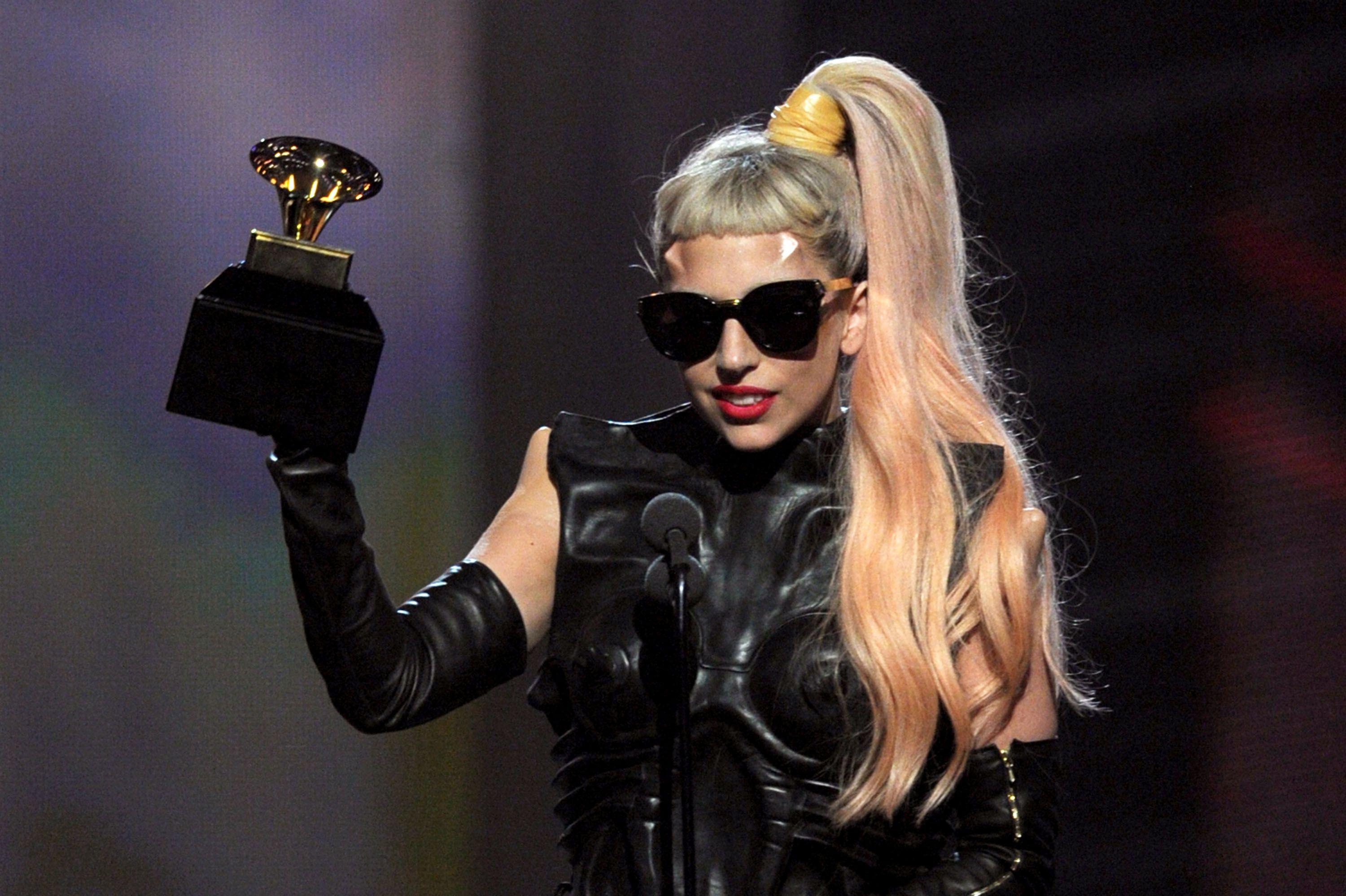 Lady Gaga receives award at the 2014 Grammy Awards