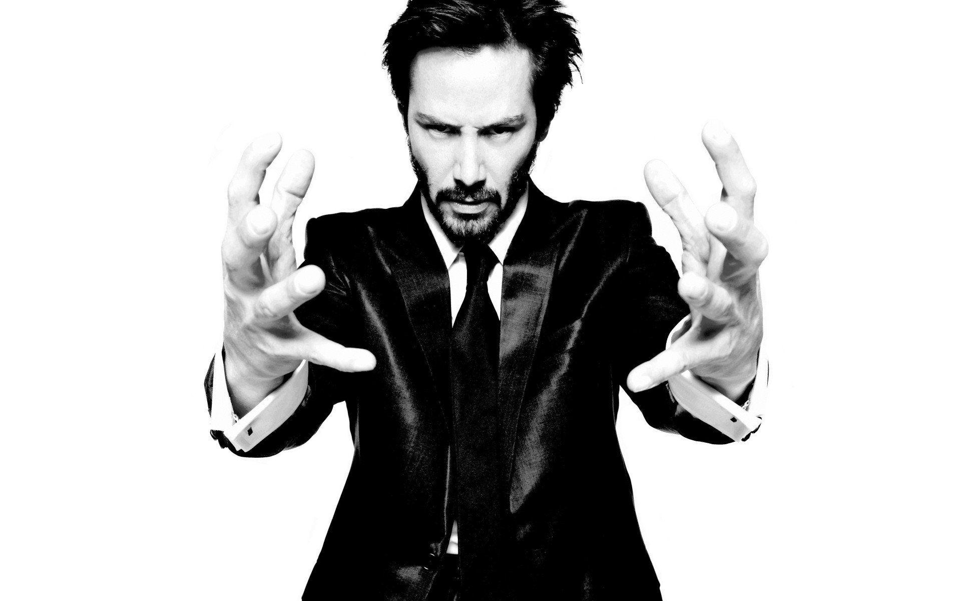 Black and white suit hands men celebrity Keanu Reeves beard actors