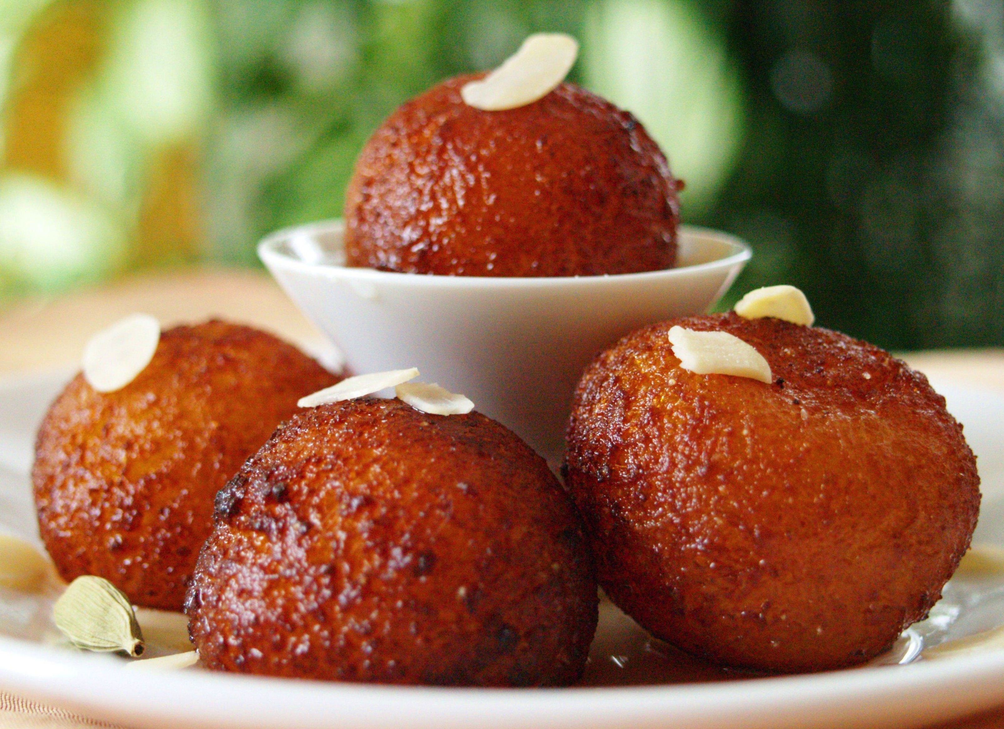 Gulab Jamun, Indian Dessert or Sweet Dish in bowl with spoon Stock Photo by  ©DipakShelare 322284592